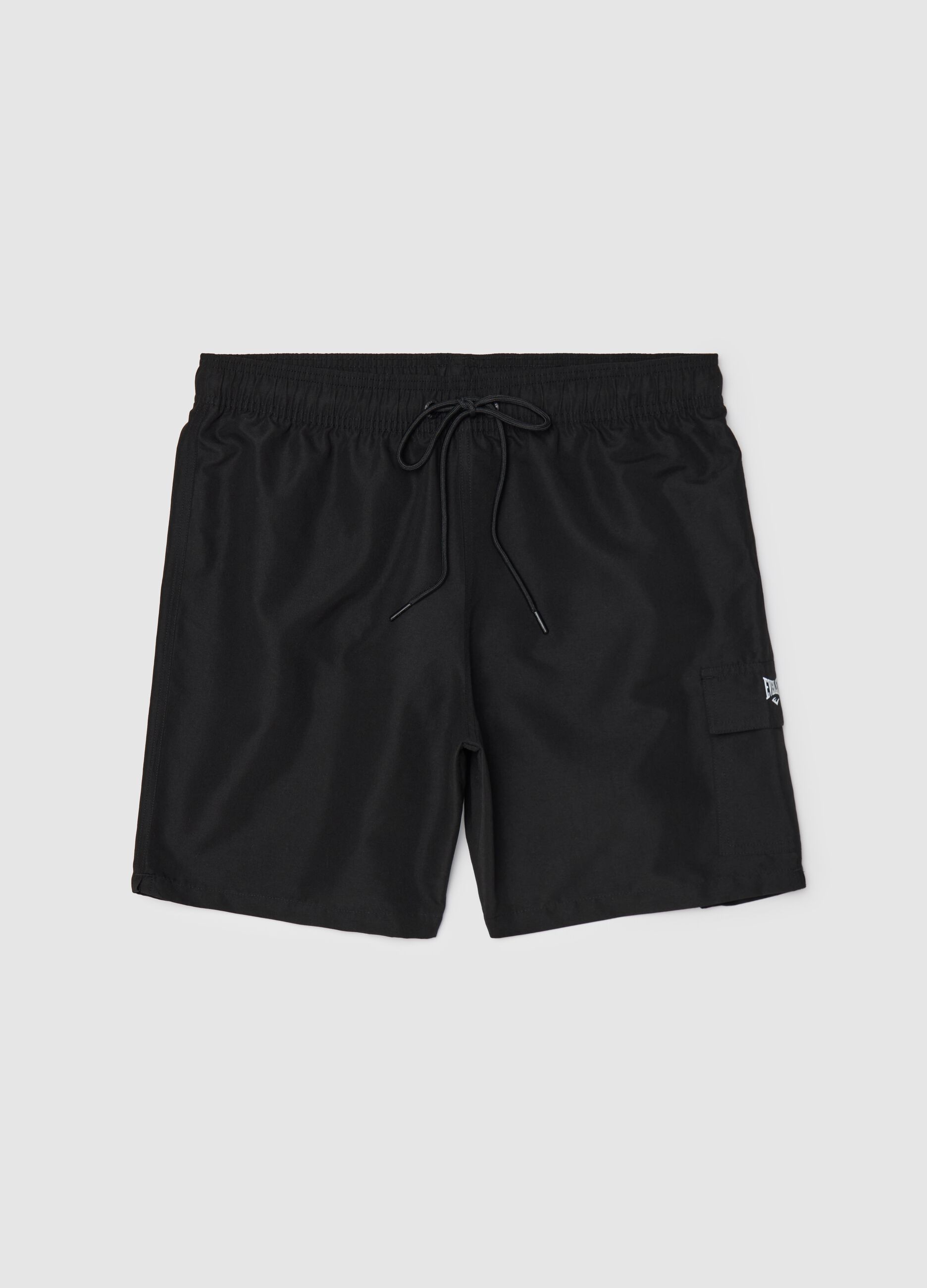 Black swimming trunks with logo print