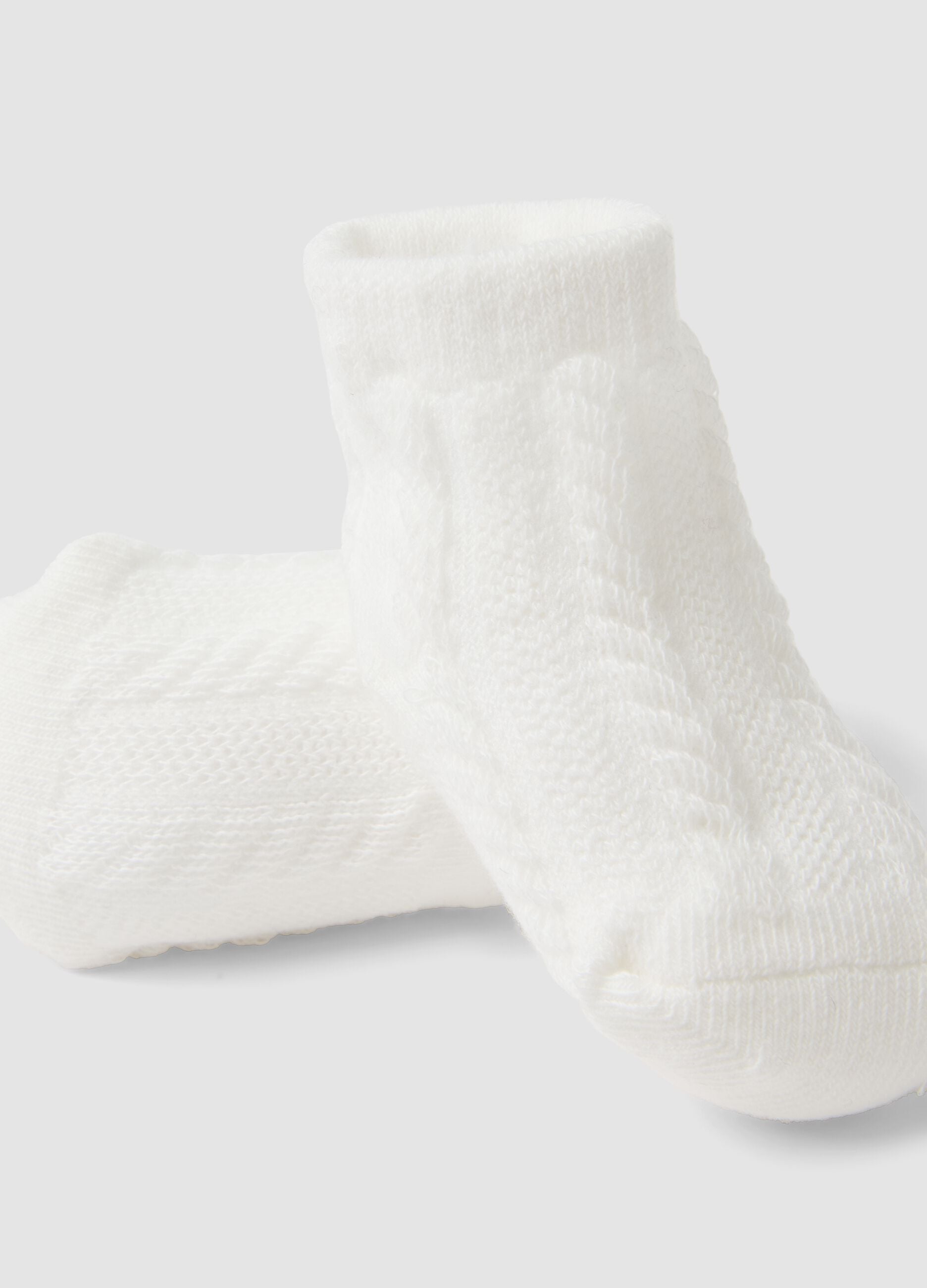 Scarpine bianche in misto cotone organico con fiocchetto per neonata