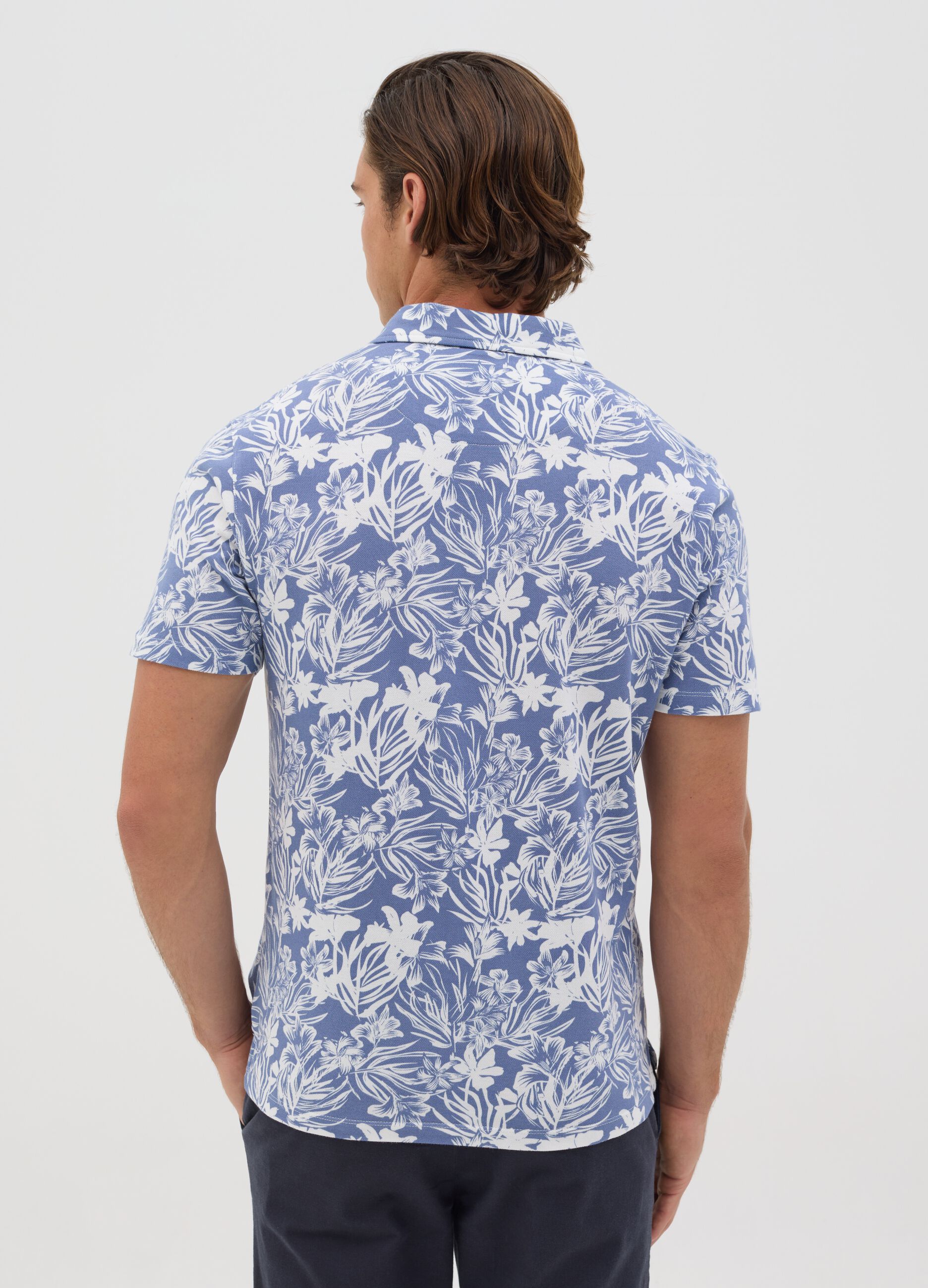 BST blue polo shirt with short sleeves and floral print