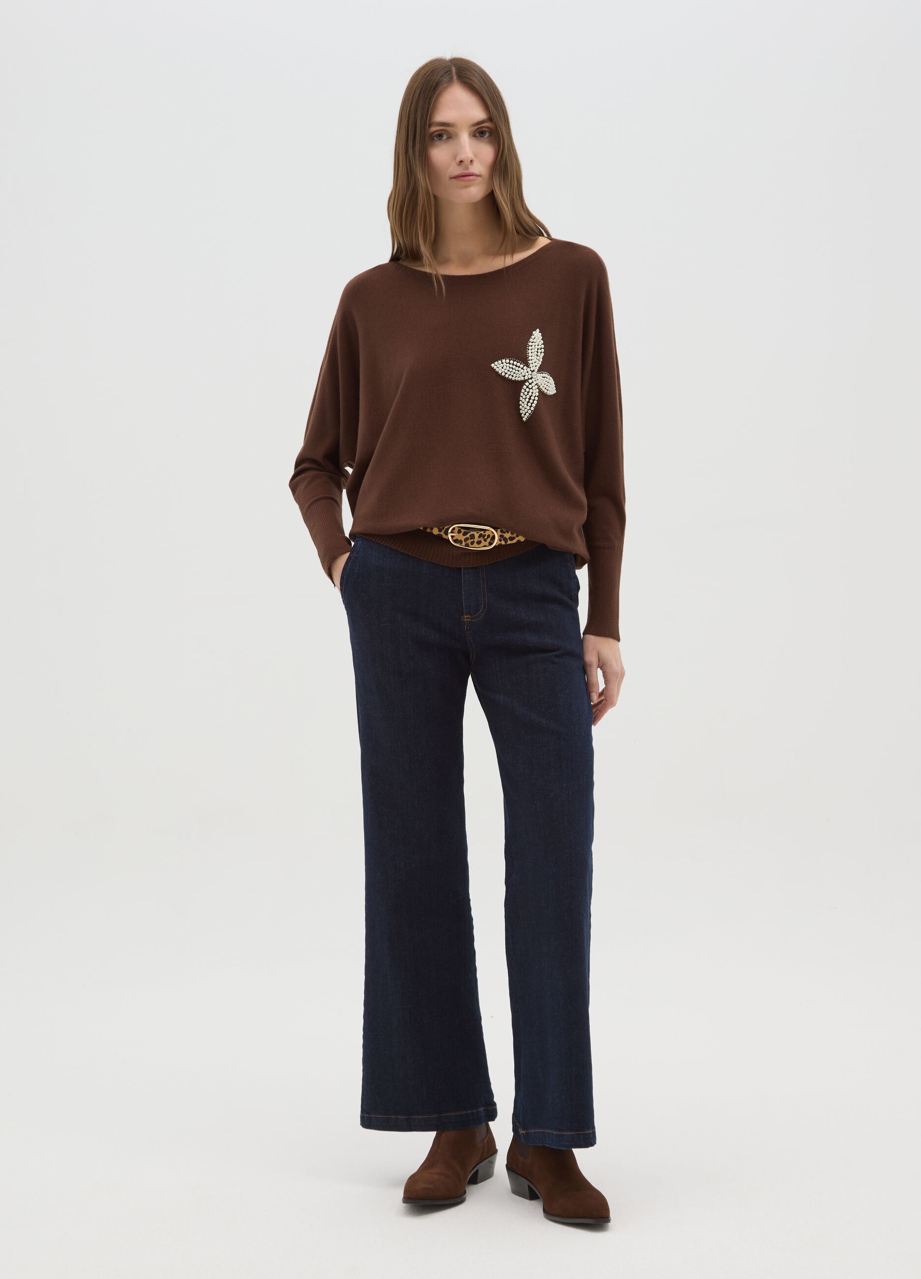 Brown sweater with bead decoration