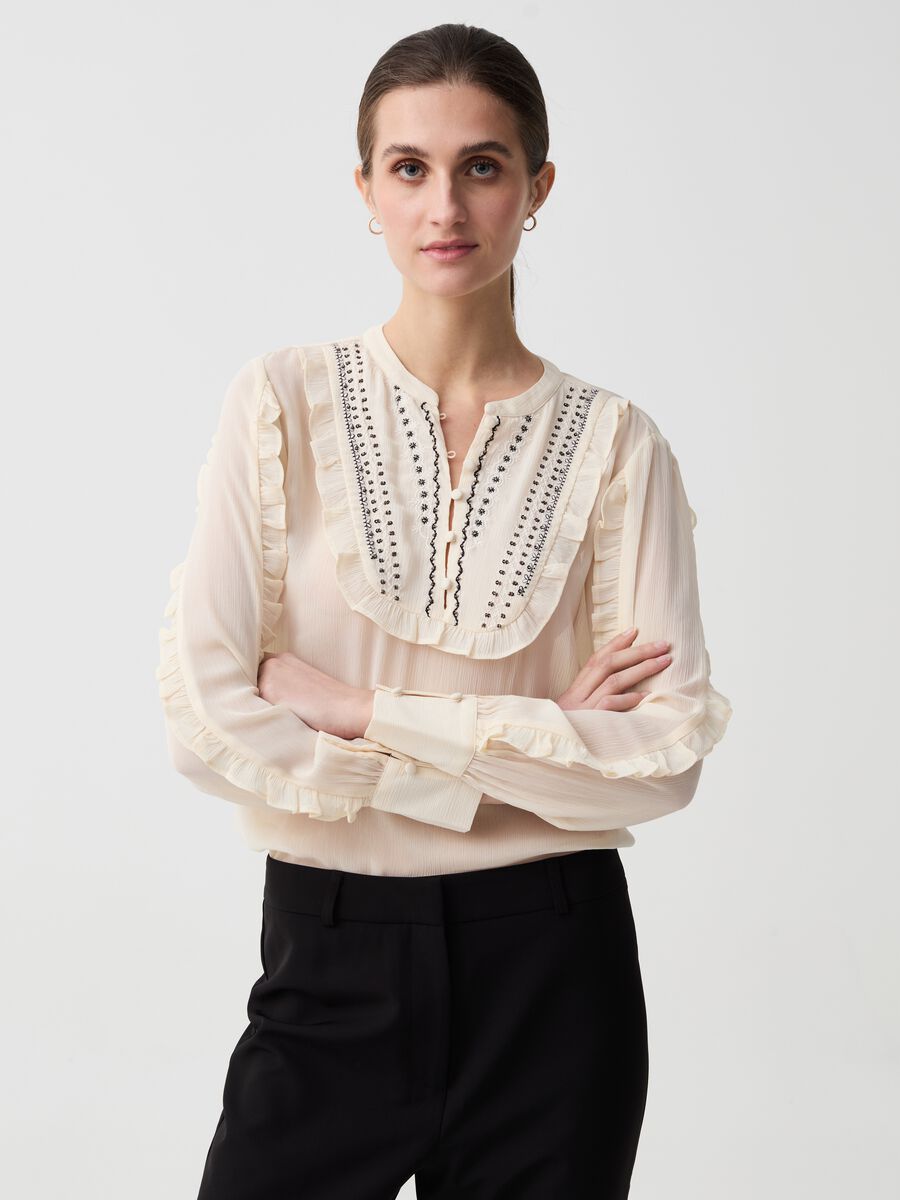 Crêpe blouse with embroidery and frills_0