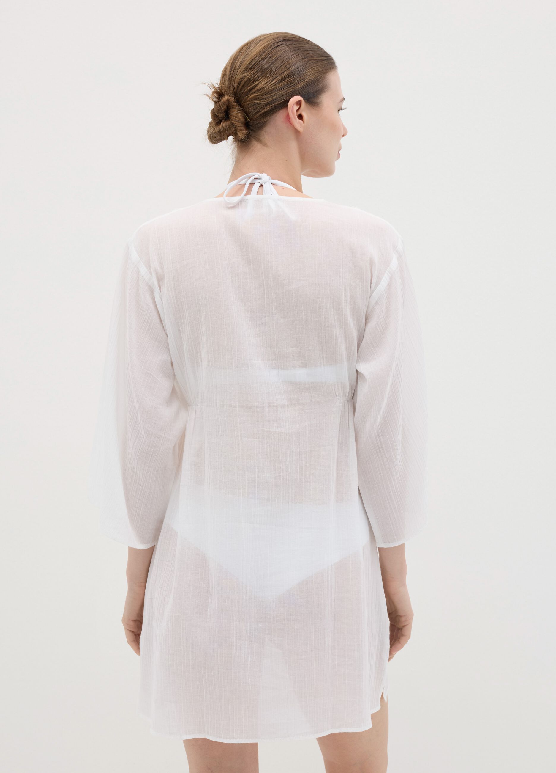 White beach cover-up with decorative edging