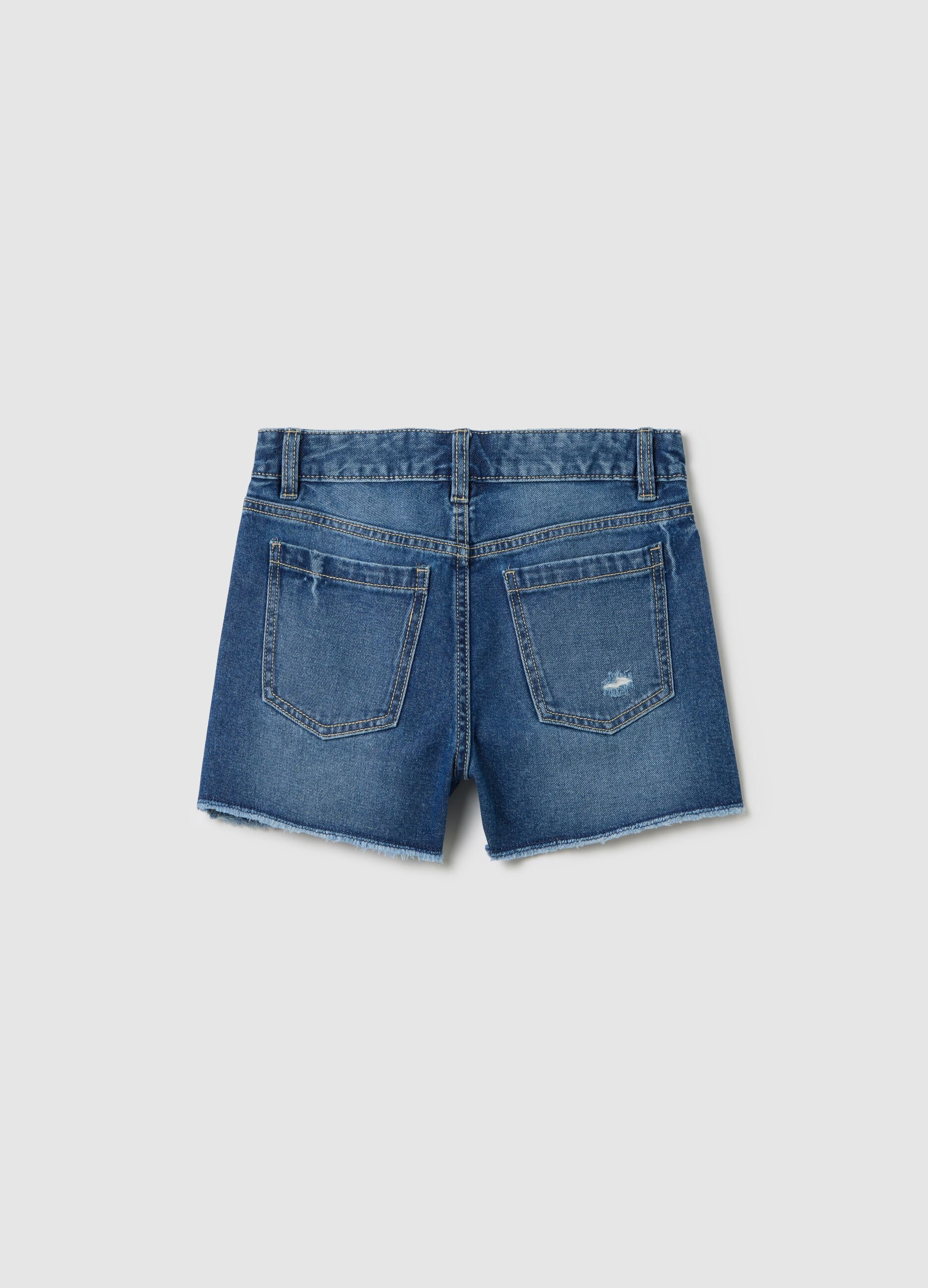 Denim shorts with five pockets and abrasions