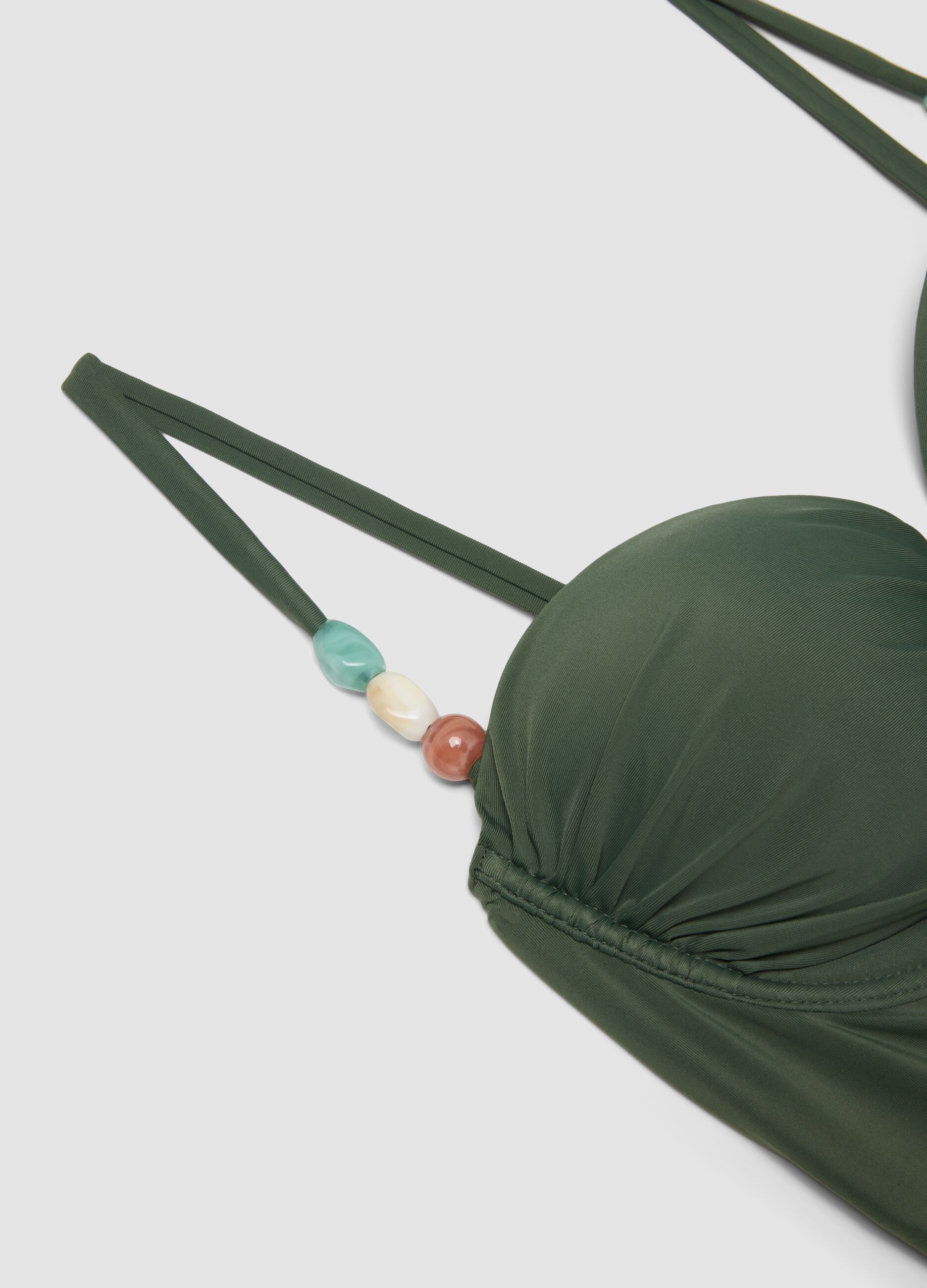 Green stretch swimsuit with embellishments