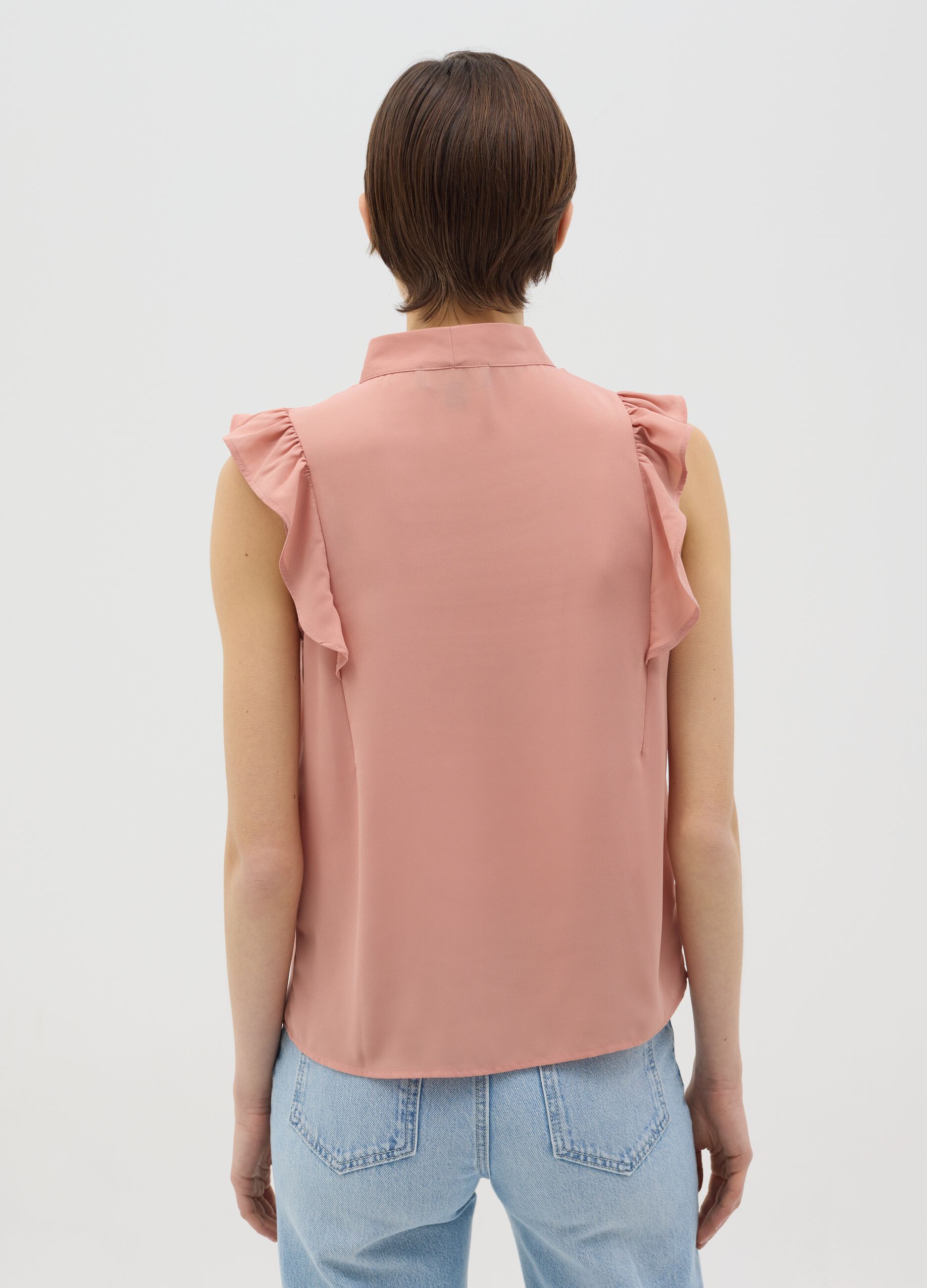 Pink sleeveless blouse with flounce