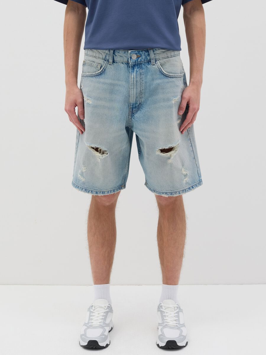 Blue denim shorts with ripped details_1