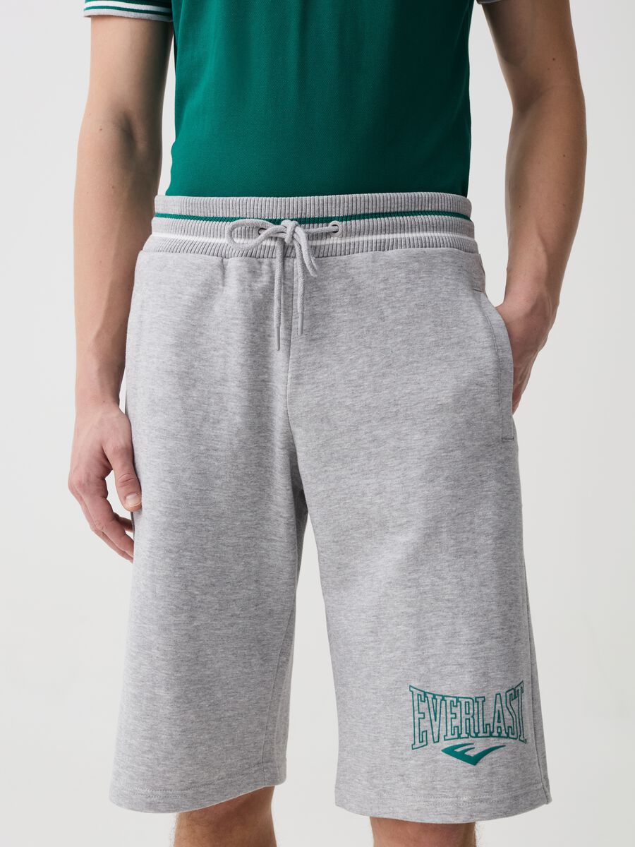Bermuda joggers with logo print and striped edging_1