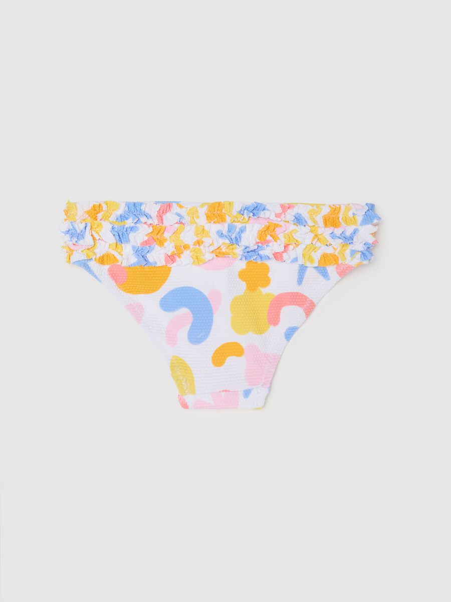Girls’ swim briefs in multicoloured stretch fabric with frill_1