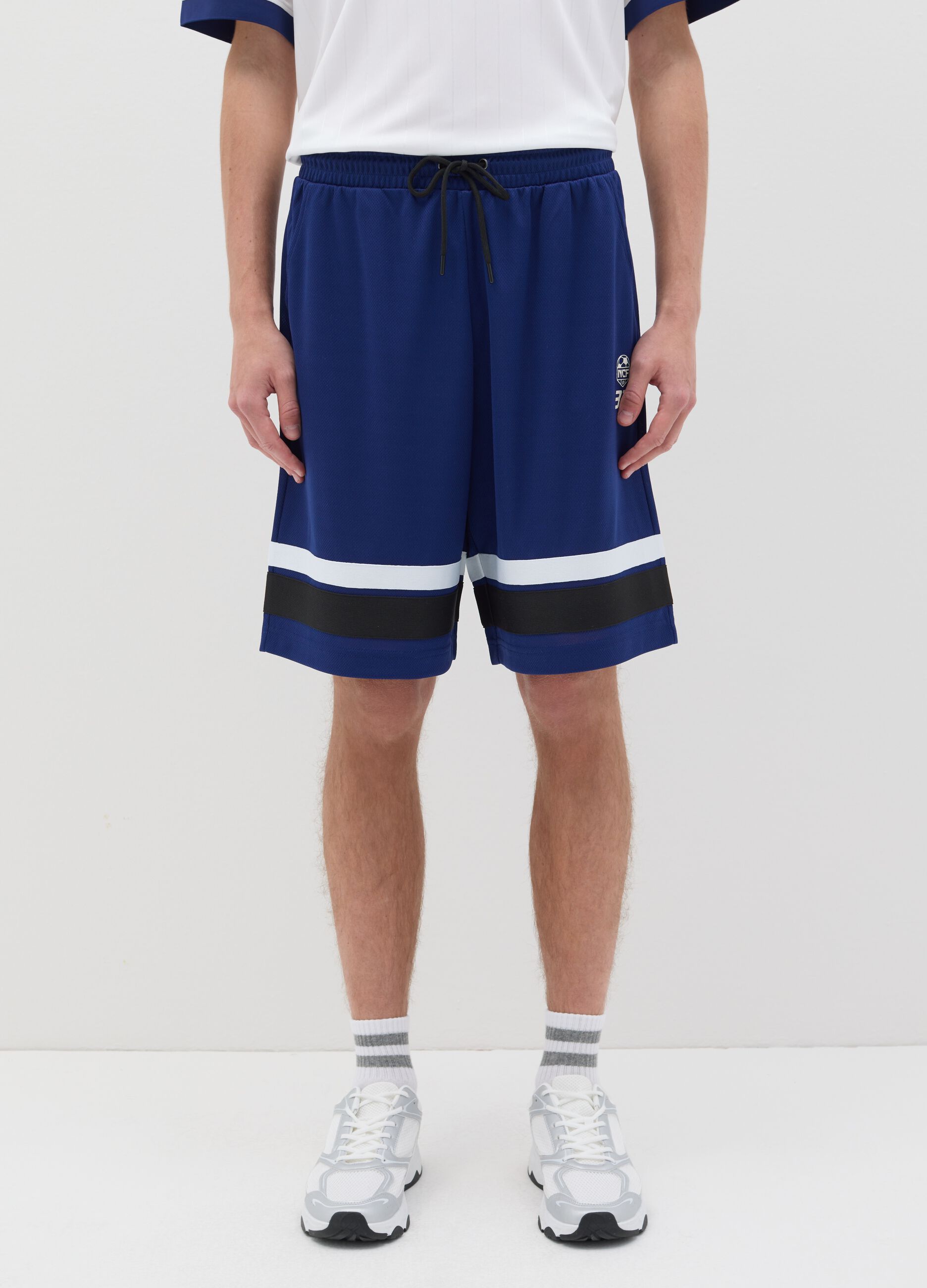 Blue Bermuda joggers with NFC print