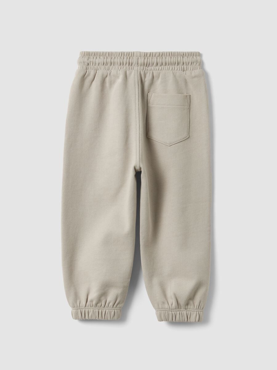 Pantaloni jogger grigi in puro cotone organico con coulisse per bimbo_1