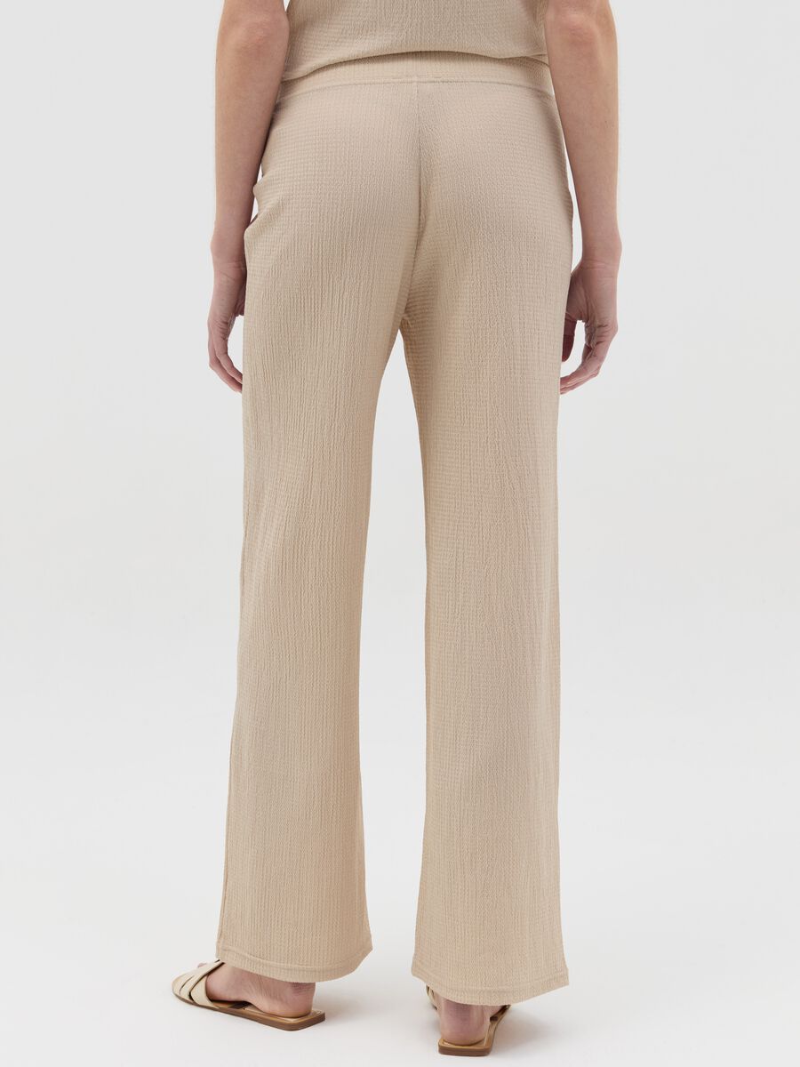 Wide-leg beige trousers with waffle weave_3