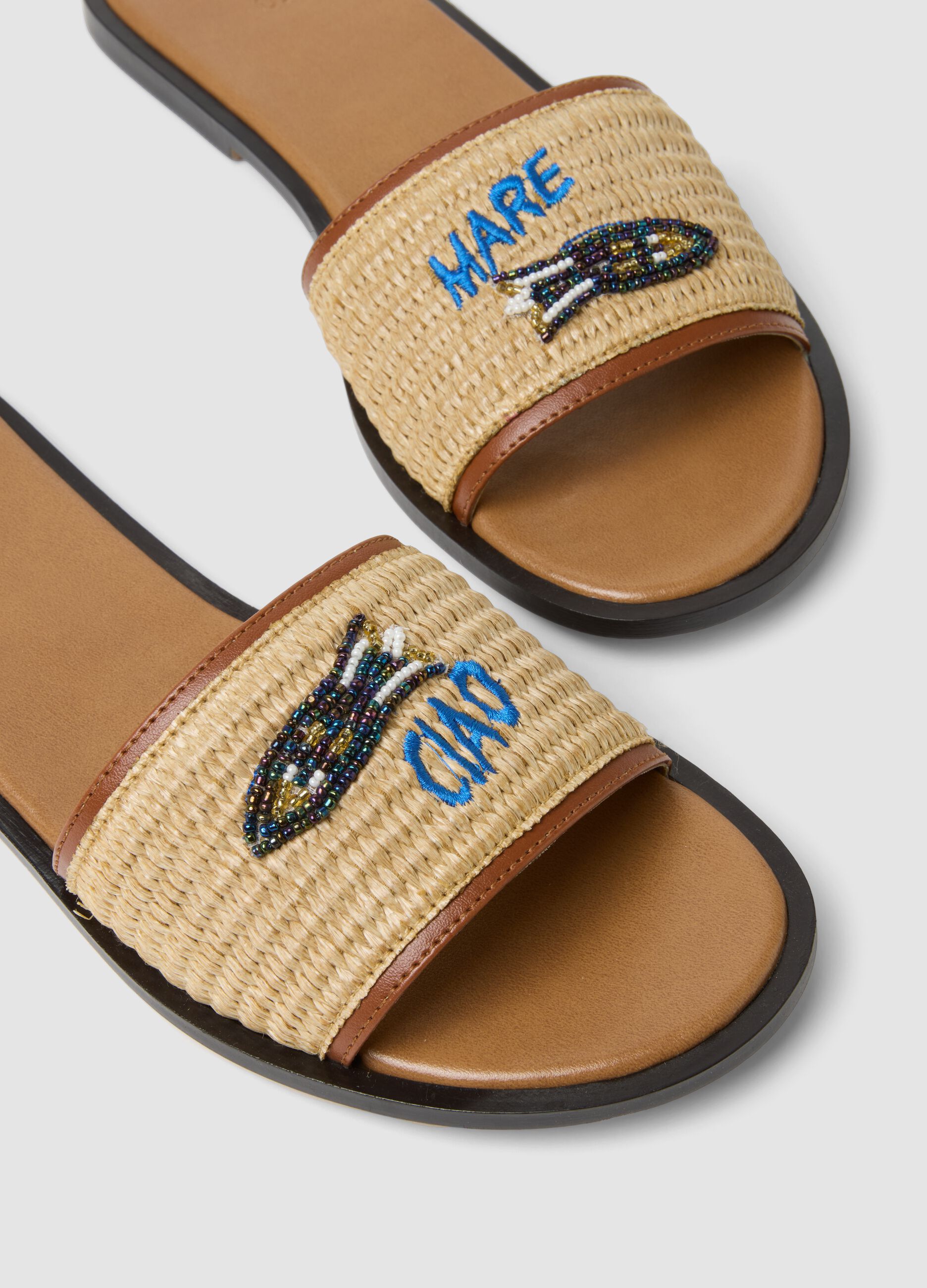 Beige flat sandals with braided embroidered strap