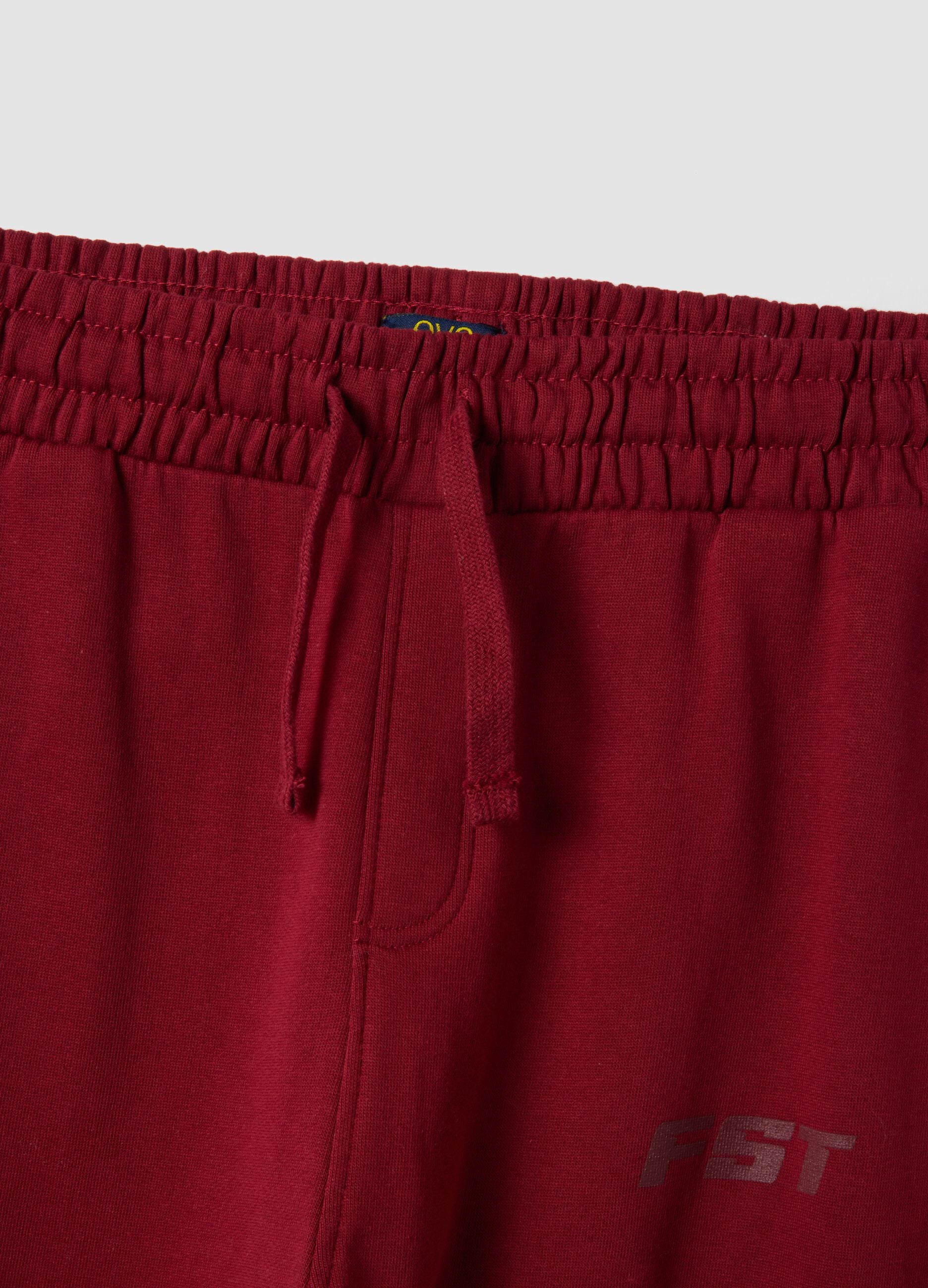 Red relaxed-fit joggers in pure organic cotton with check print