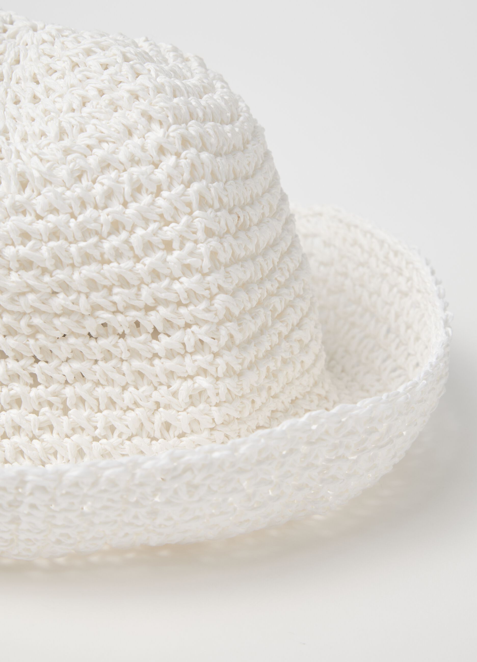 White cloche hat in woven straw