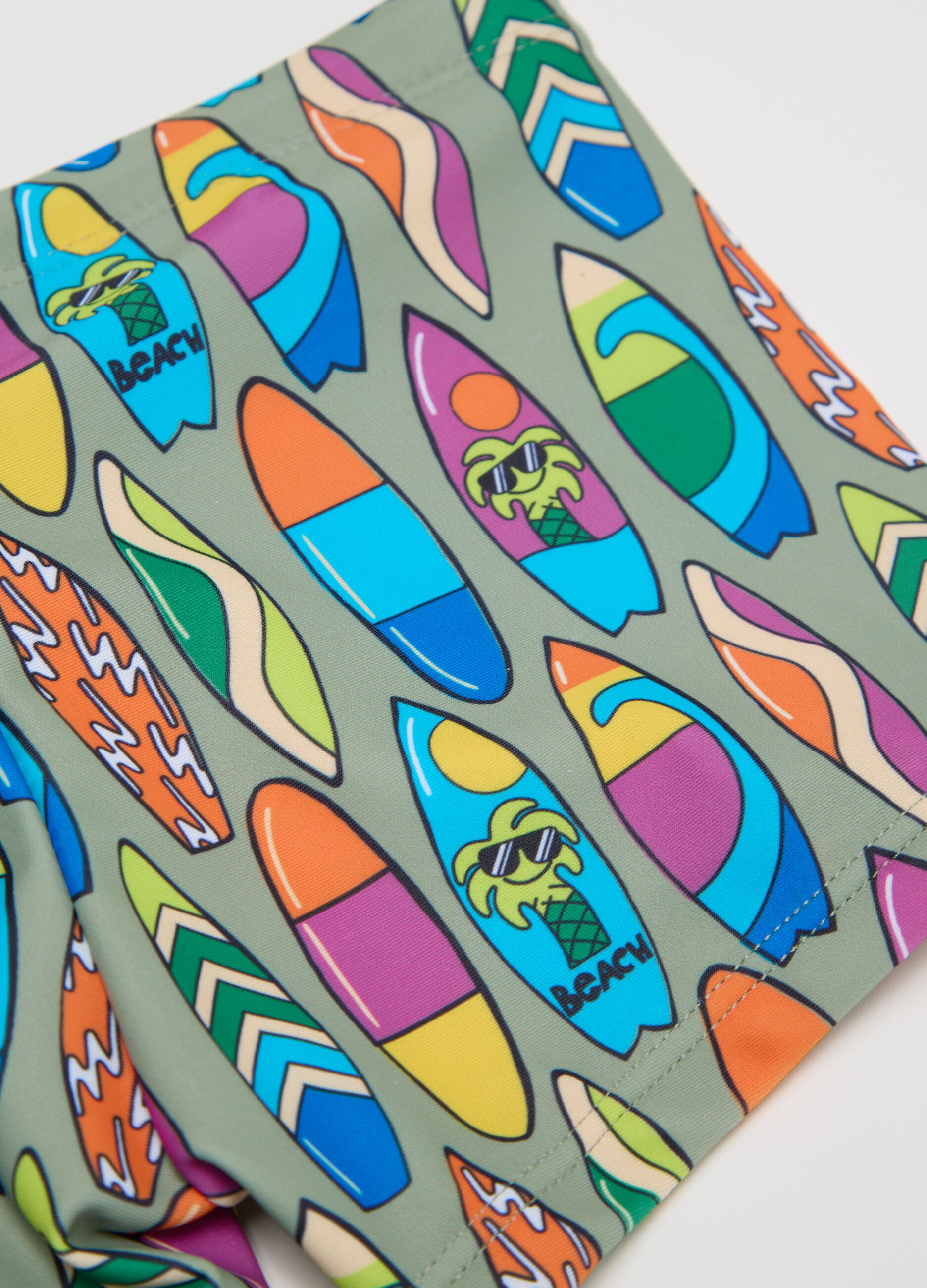 Boys’ swim briefs in multicoloured stretch fabric with print