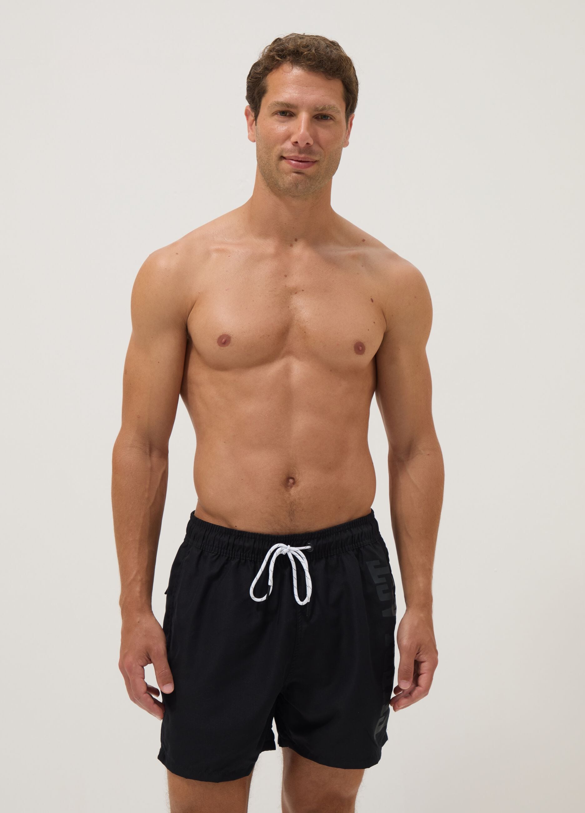 Black swim shorts with drawstring waist