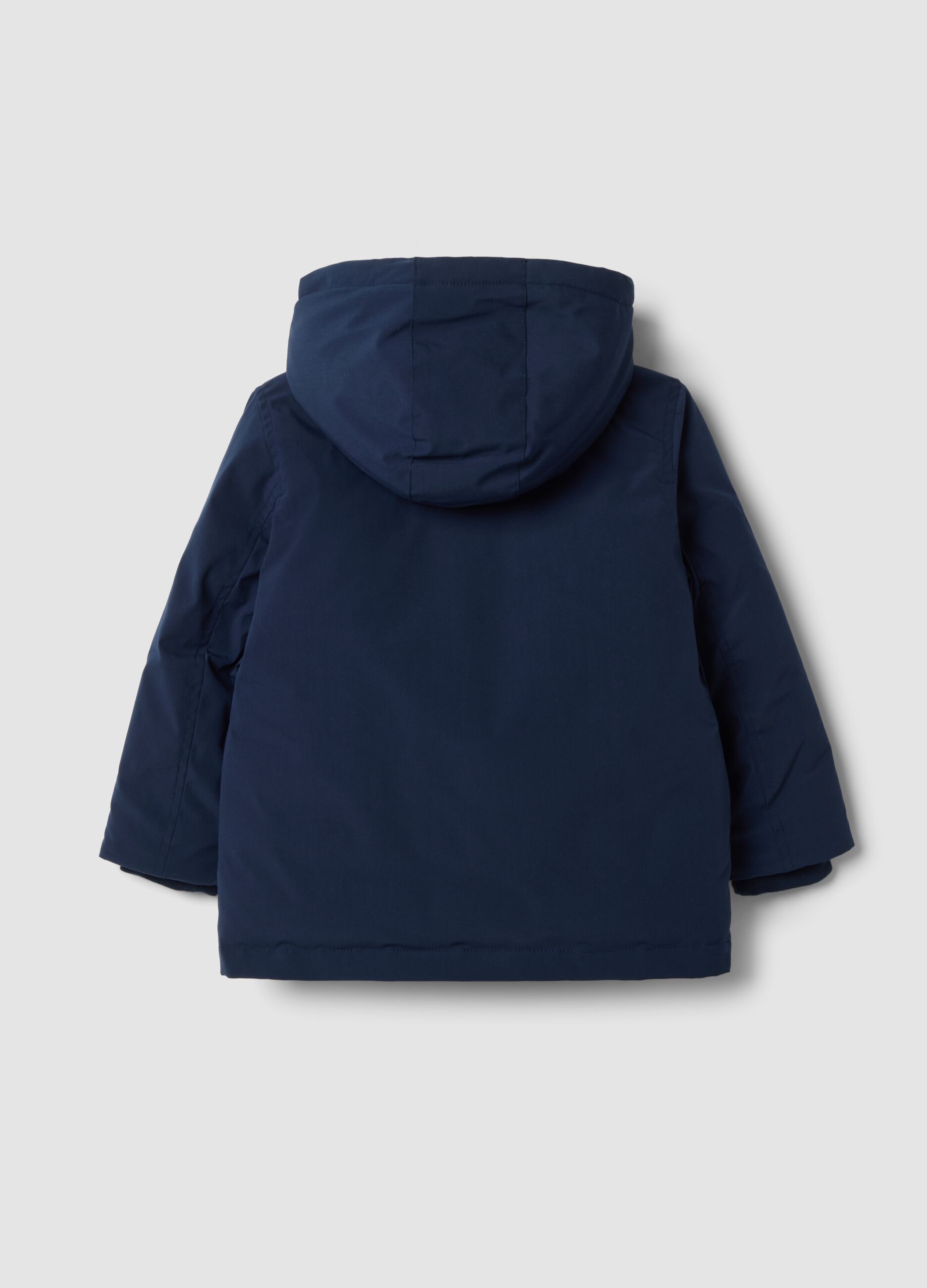 Long padded navy parka with detachable hood, oversized fit