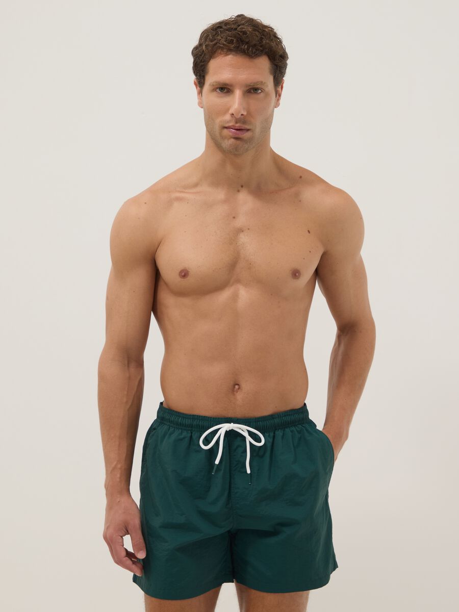 Green swim shorts with elasticated waistband_0