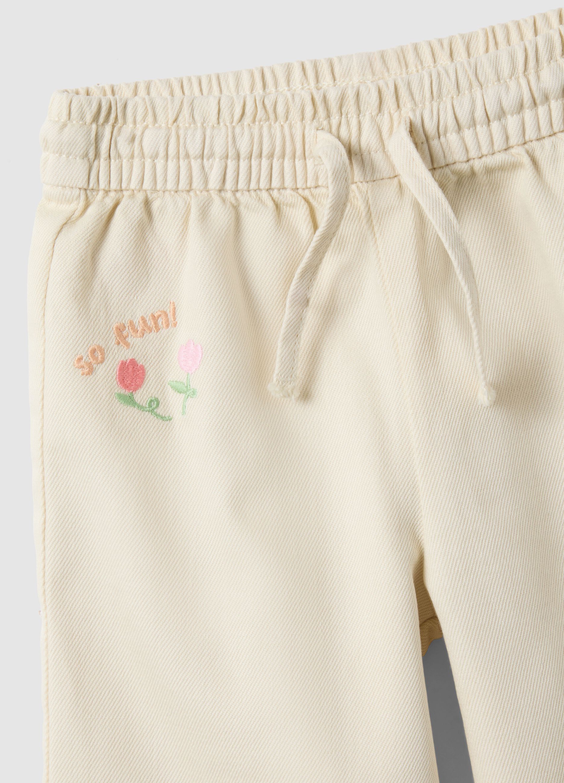 Beige wide-leg pure cotton trousers for baby girls with embroidered detailing