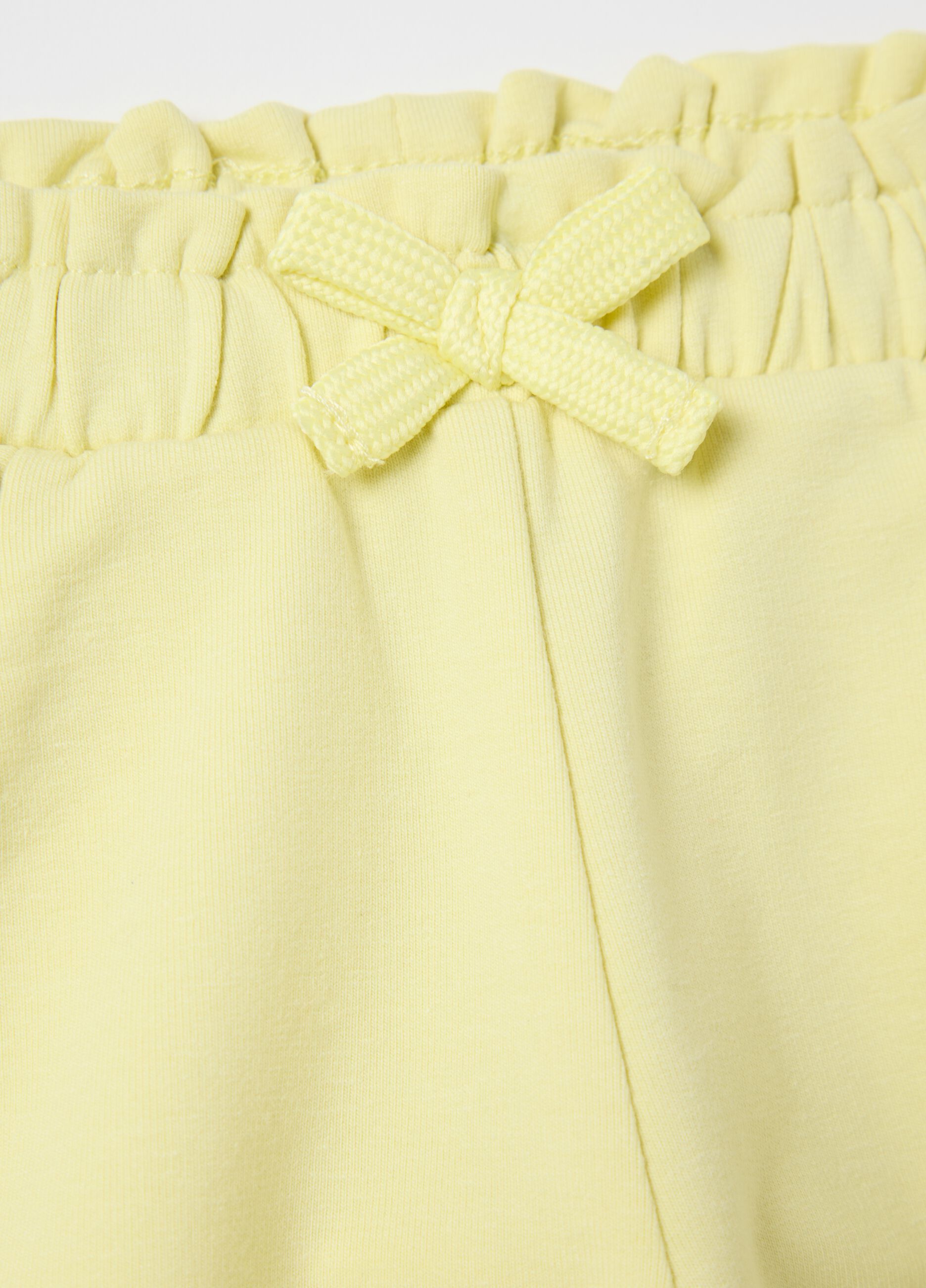 Yellow French terry shorts with bow and frills
