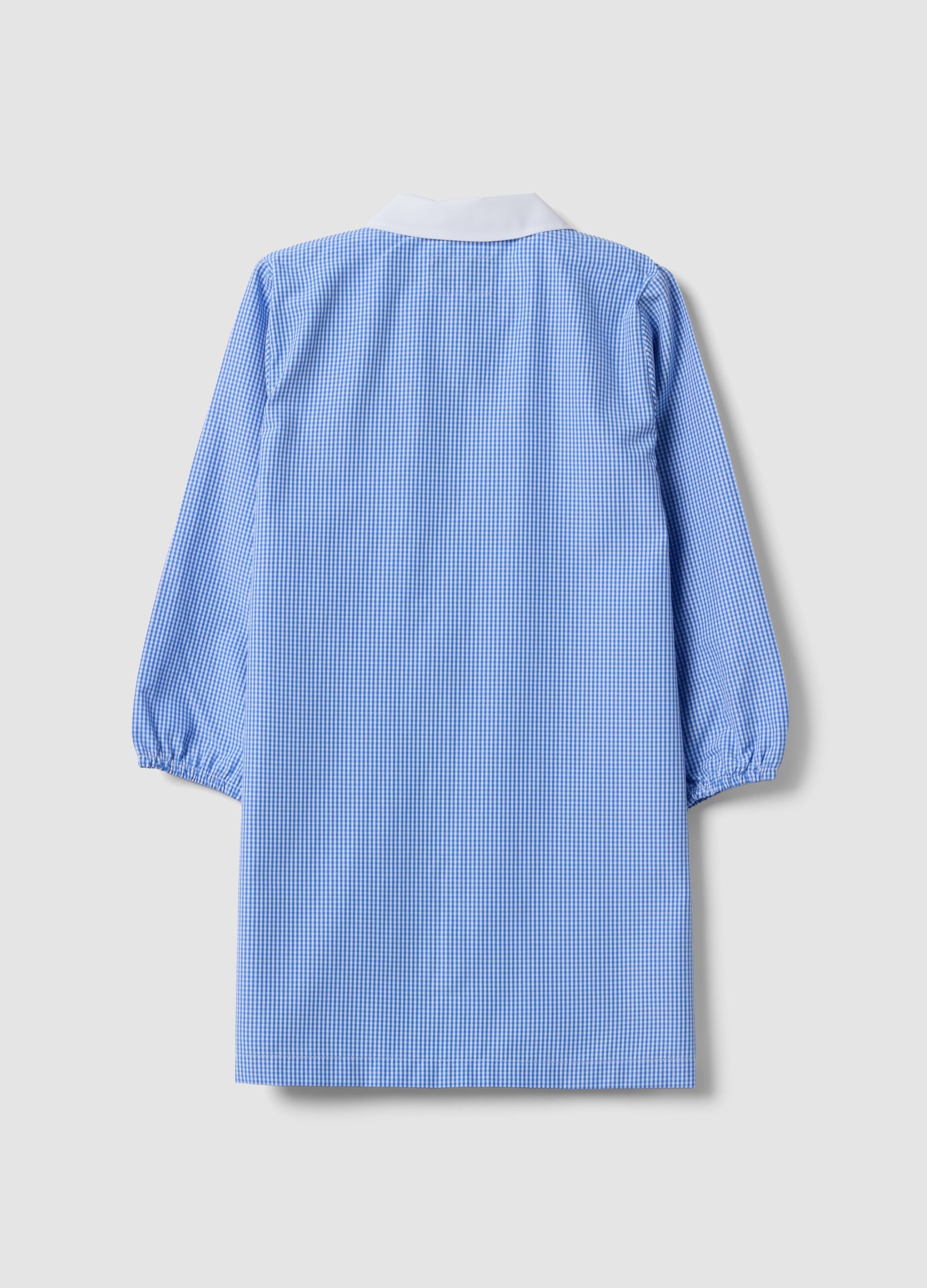 Light blue gingham nursery apron with zip and machine embroidery