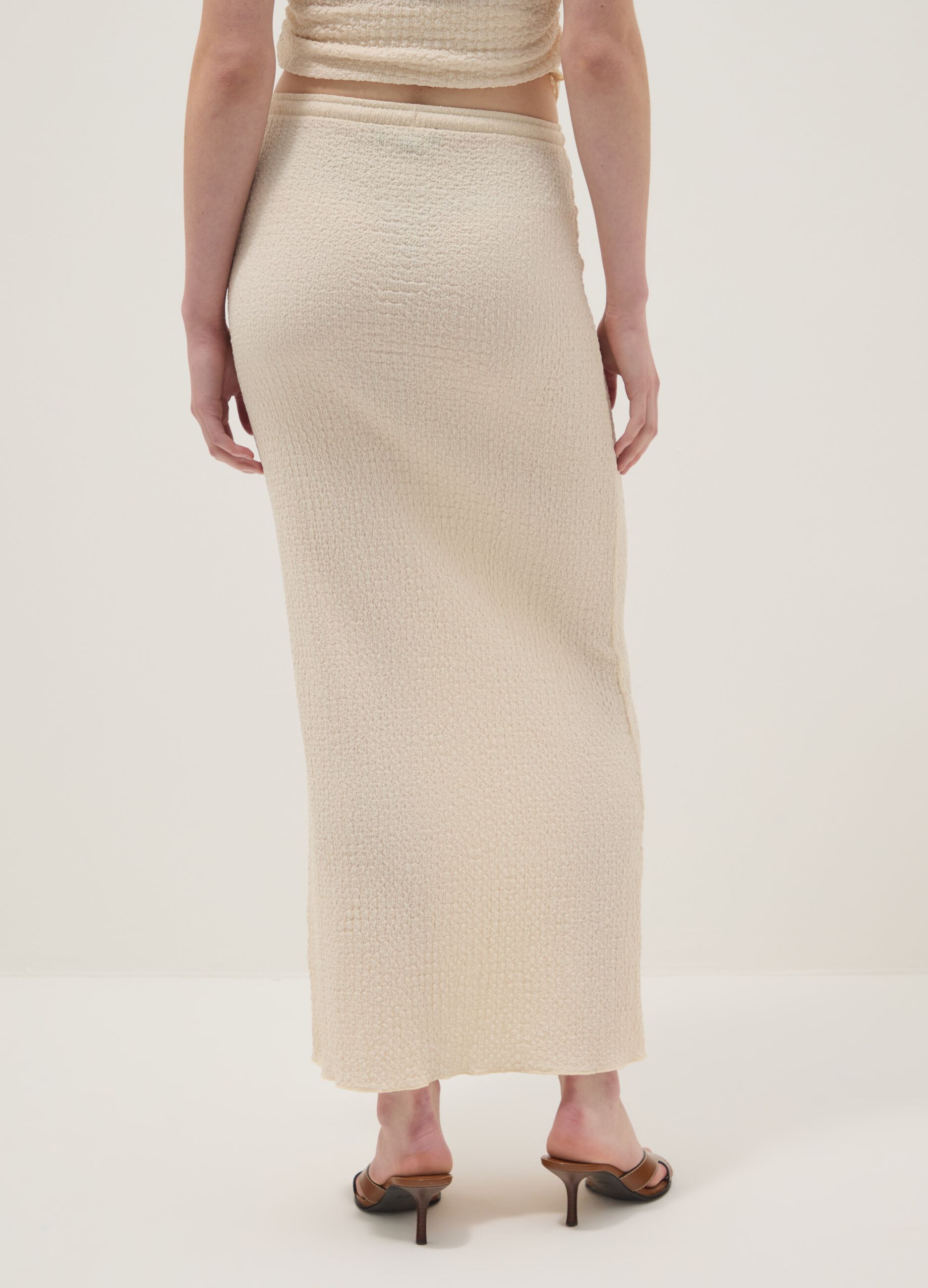 Beige long skirt in stretchy textured fabric