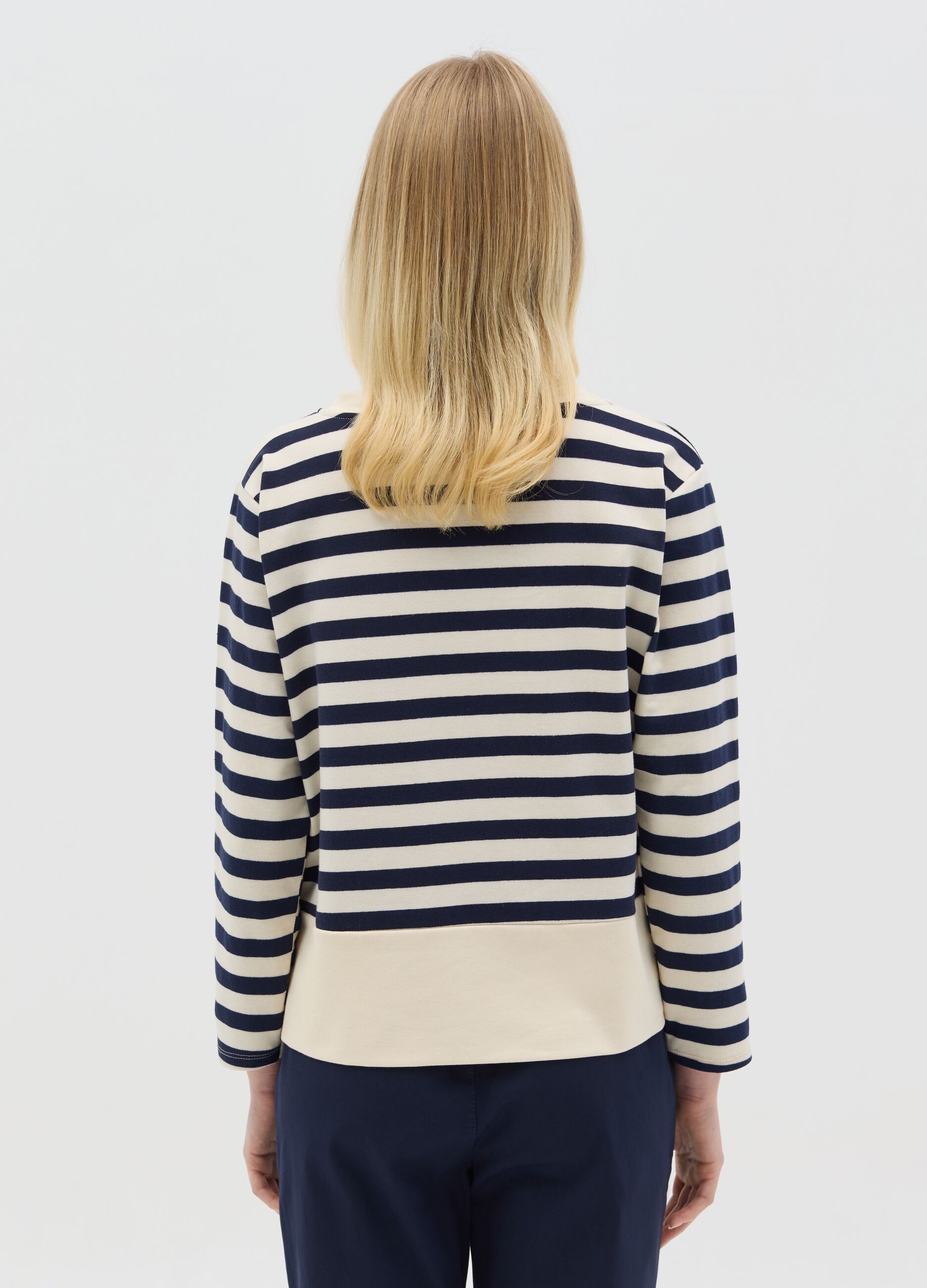 Blue and white striped top with long sleeves