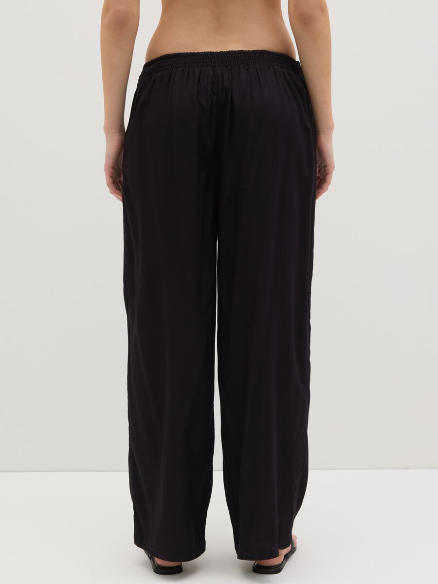 Long black beach cover-up trousers with drawstring_3