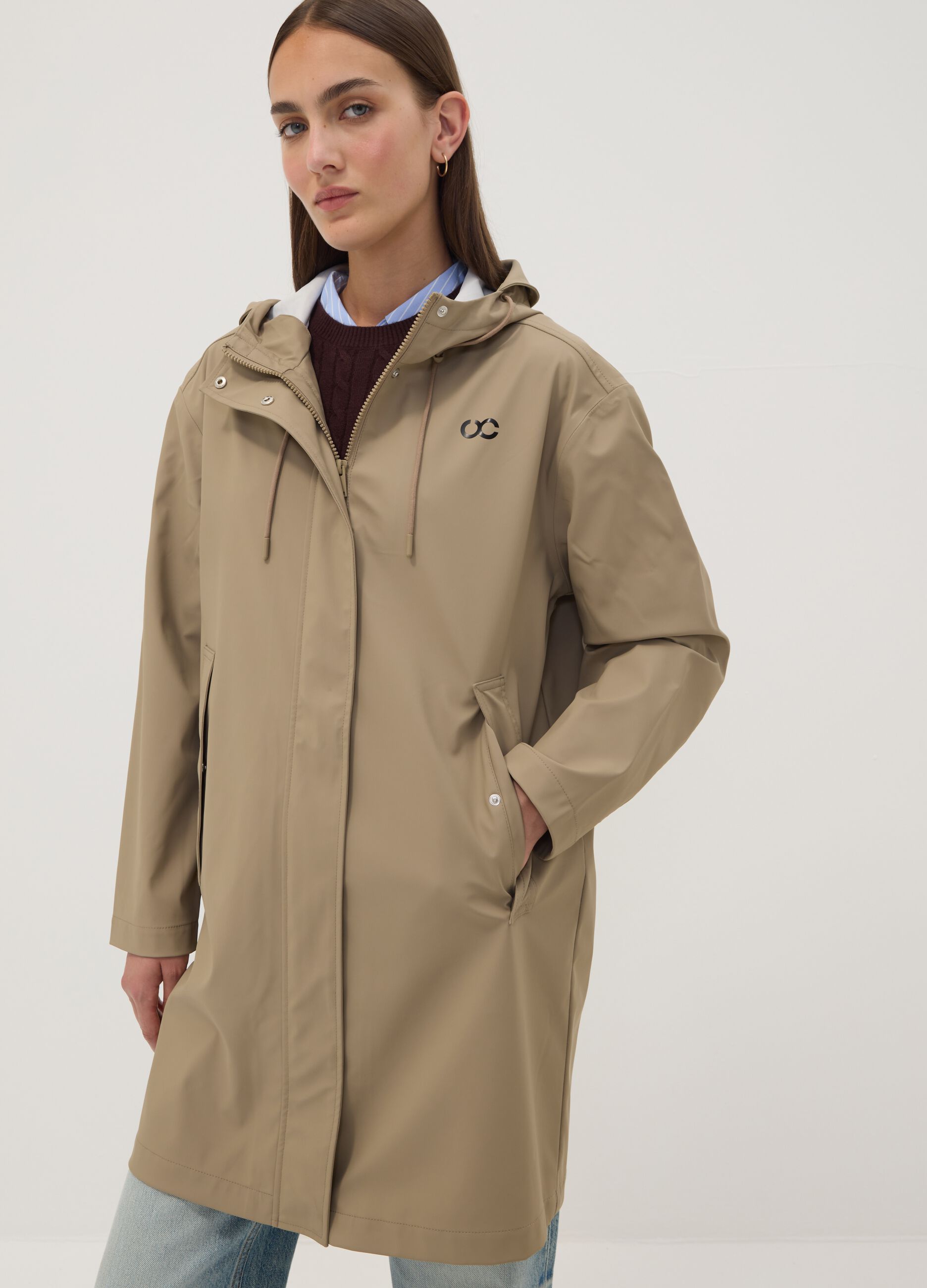 Giacca lunga beige con cappuccio e zip