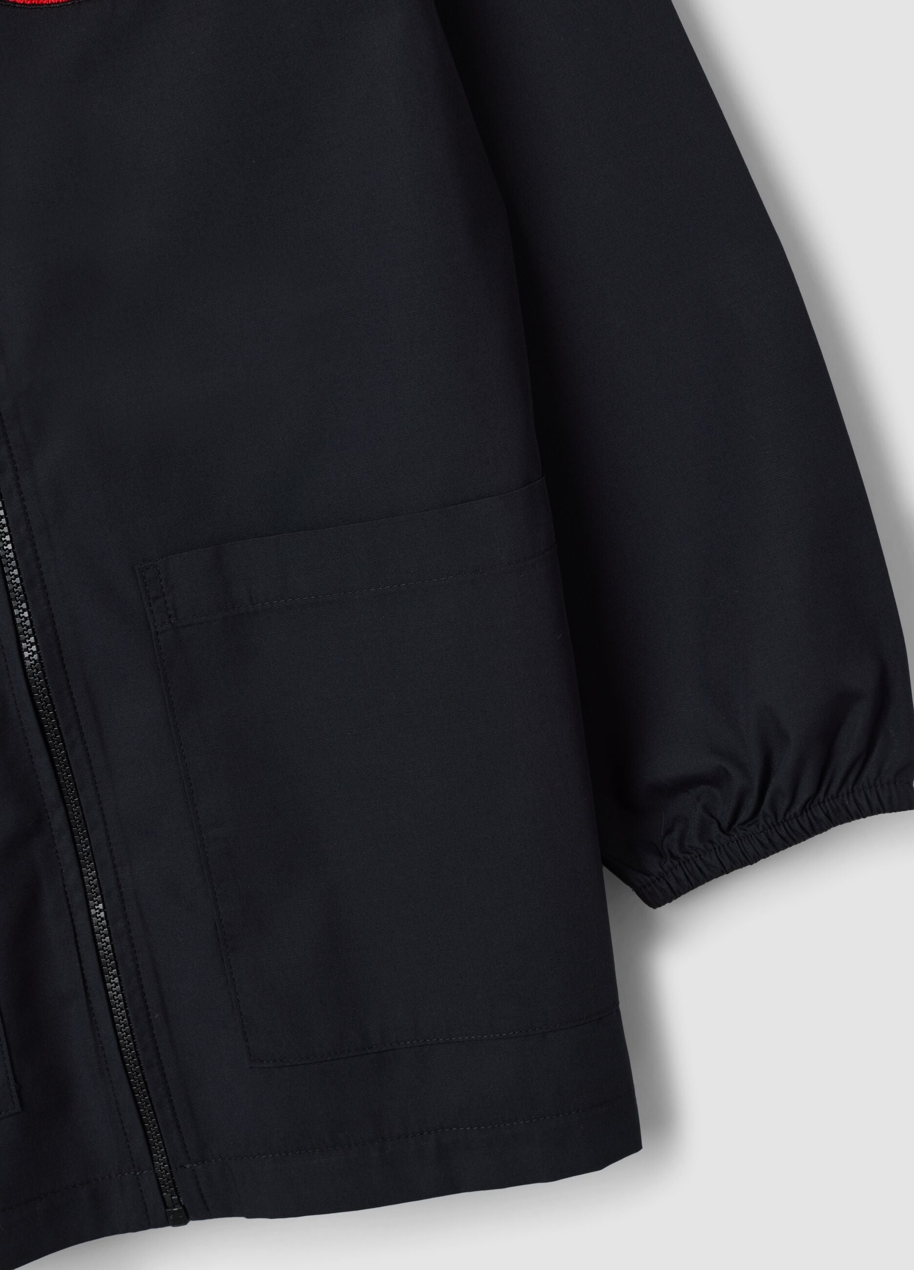 Black school apron with zip and go-kart embroidery for boys