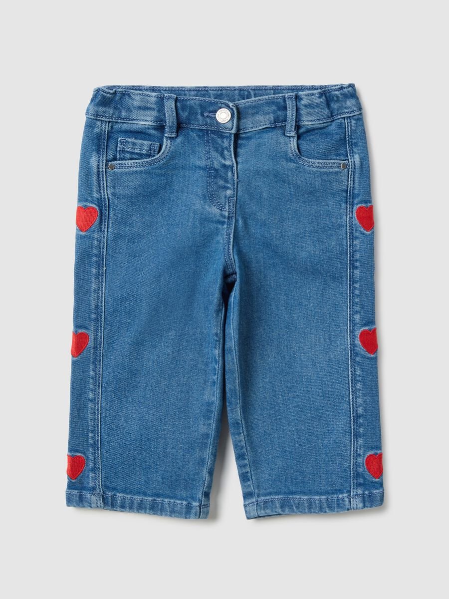 Wide blue denim jeans in cotton blend with embroidered hearts for girls_0