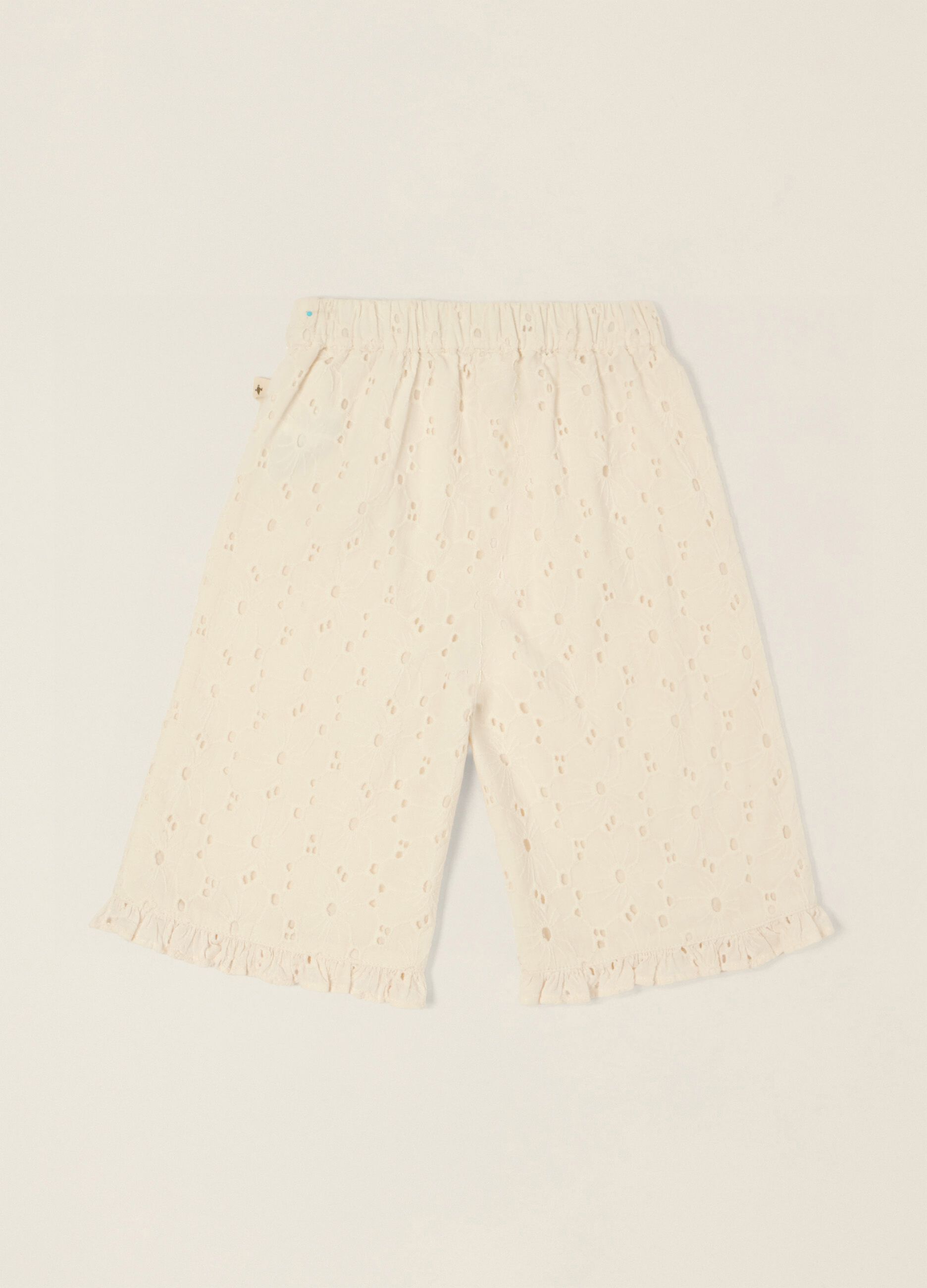 White broderie cotton trousers for baby girls