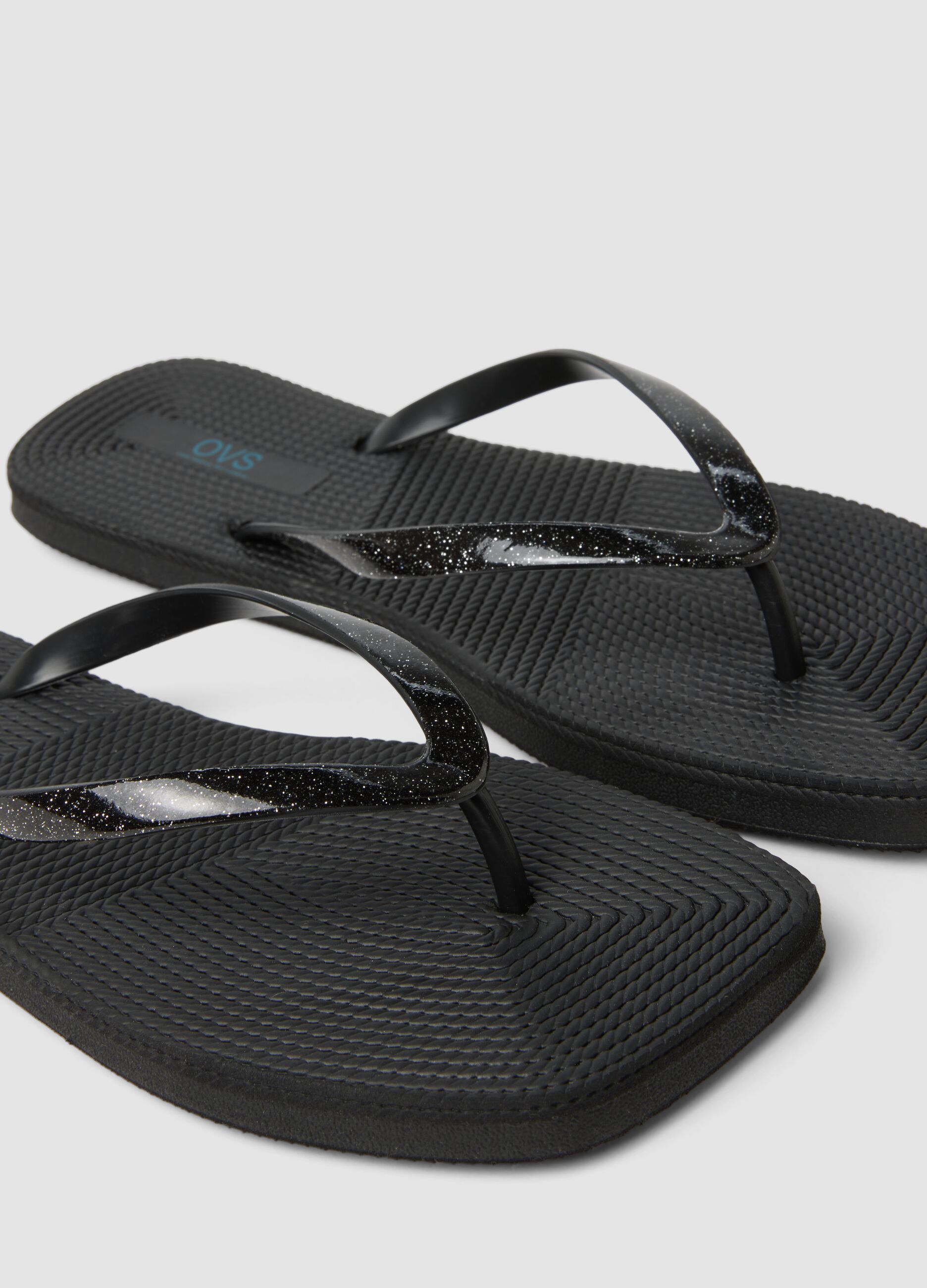 Black flip-flops with glitter straps