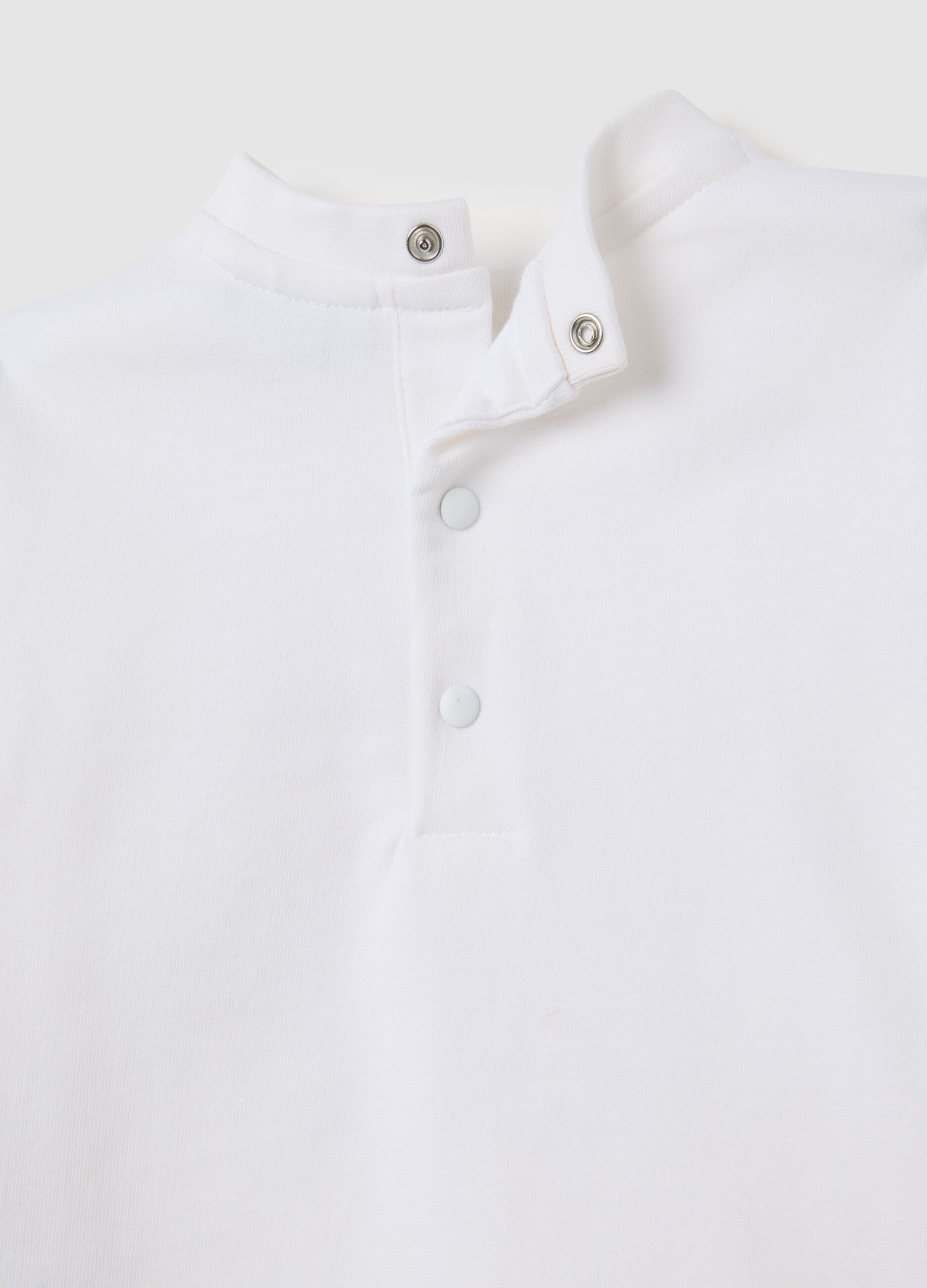 Set of child's t-shirt and trousers in pure white and beige cotton