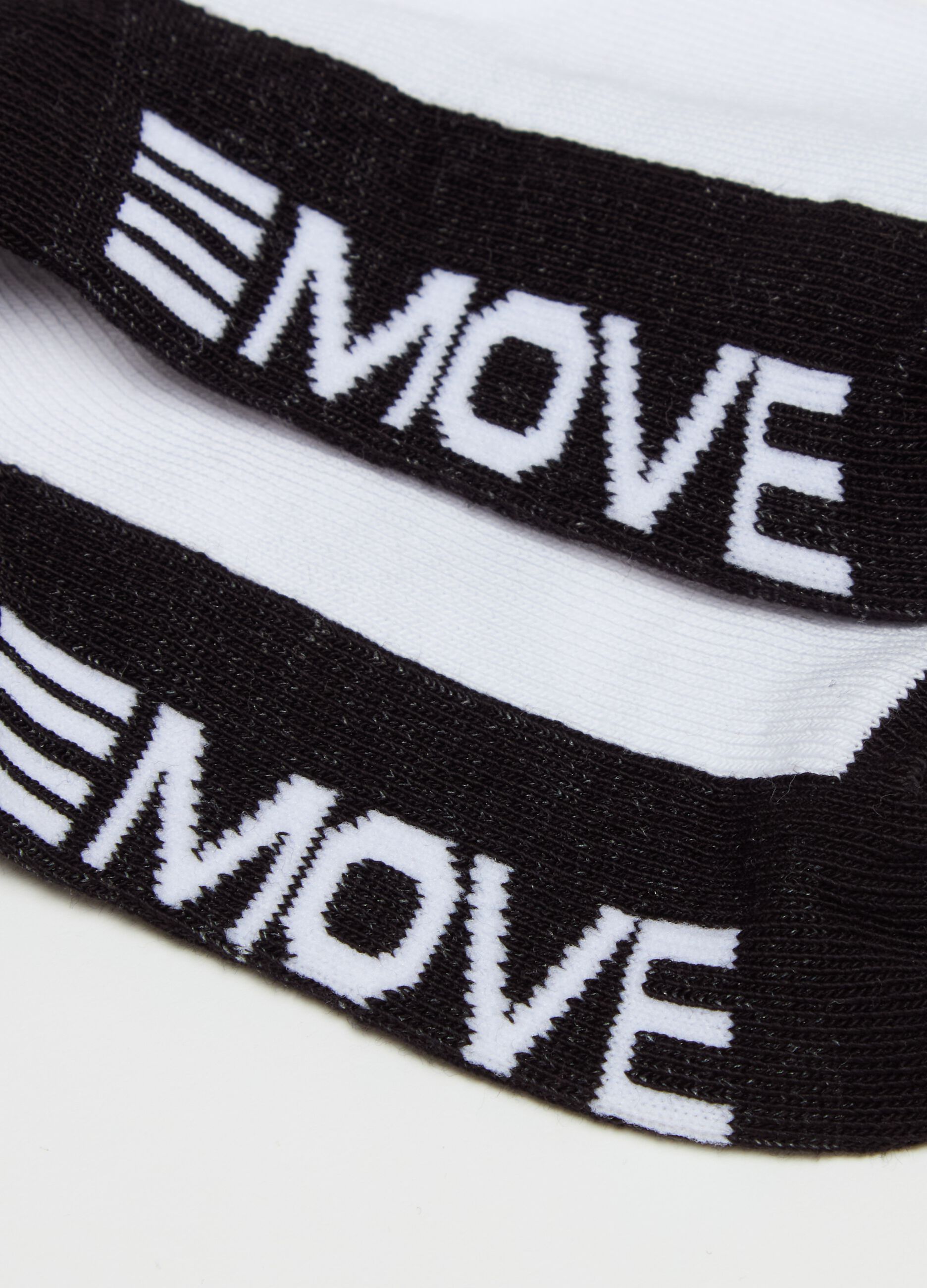 Three-pair pack stretch shoe liners with "Move On" lettering