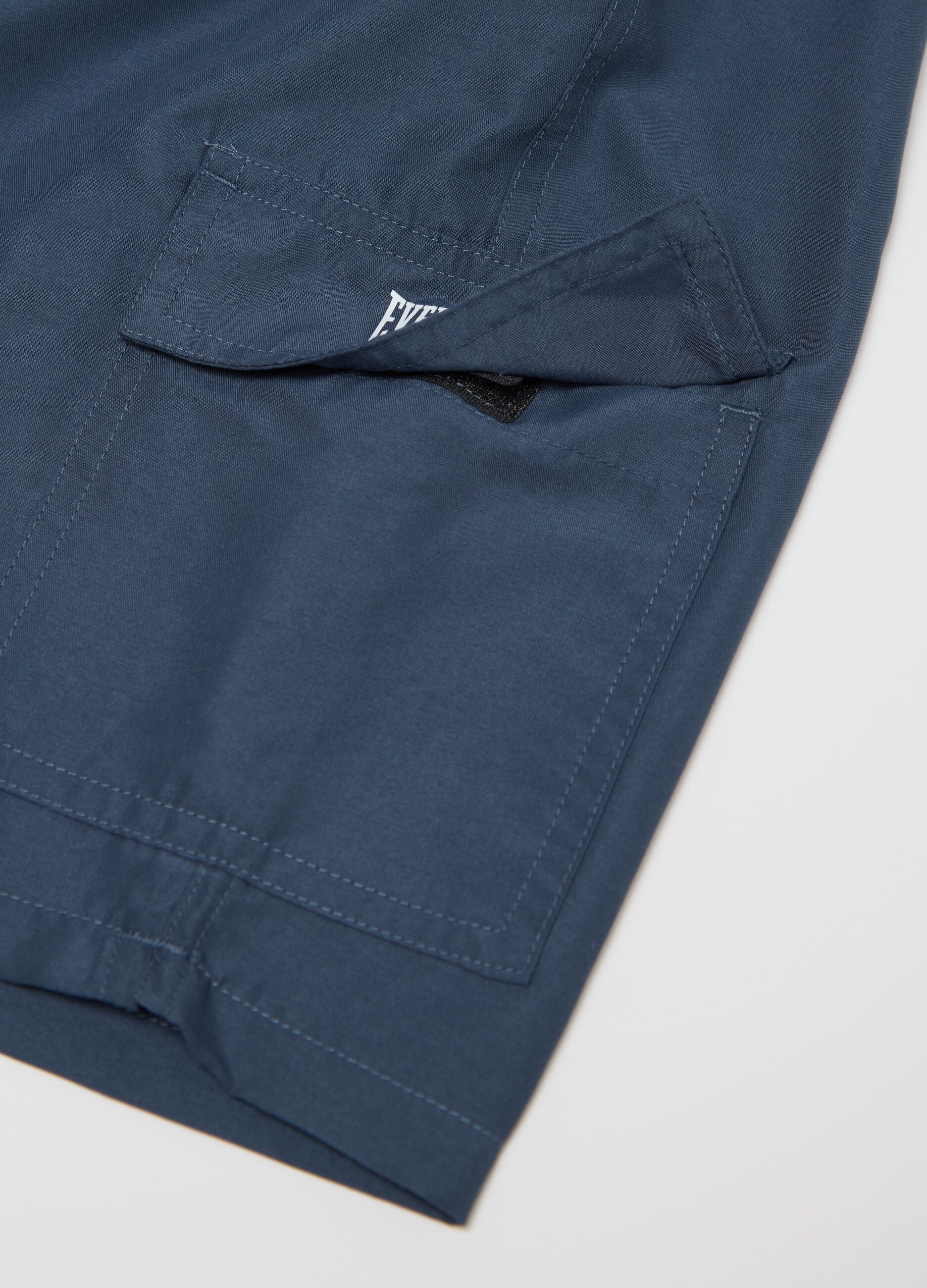 Blue swimming trunks with logo print