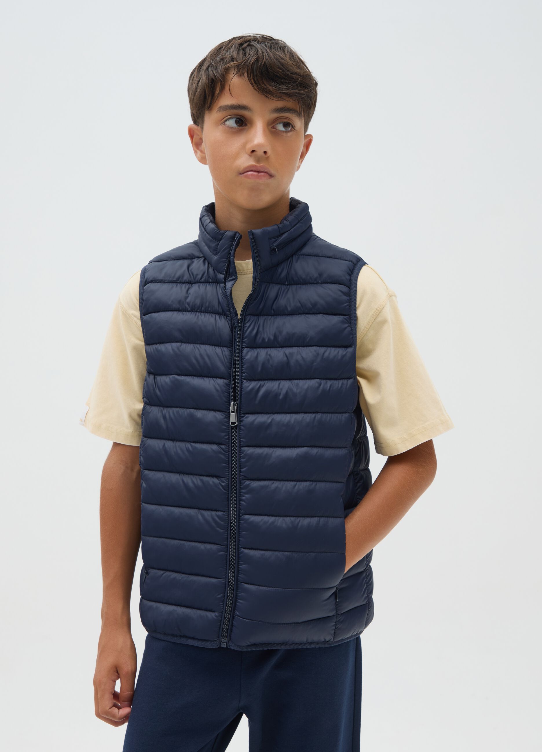 Boy's blue gilet with high collar
