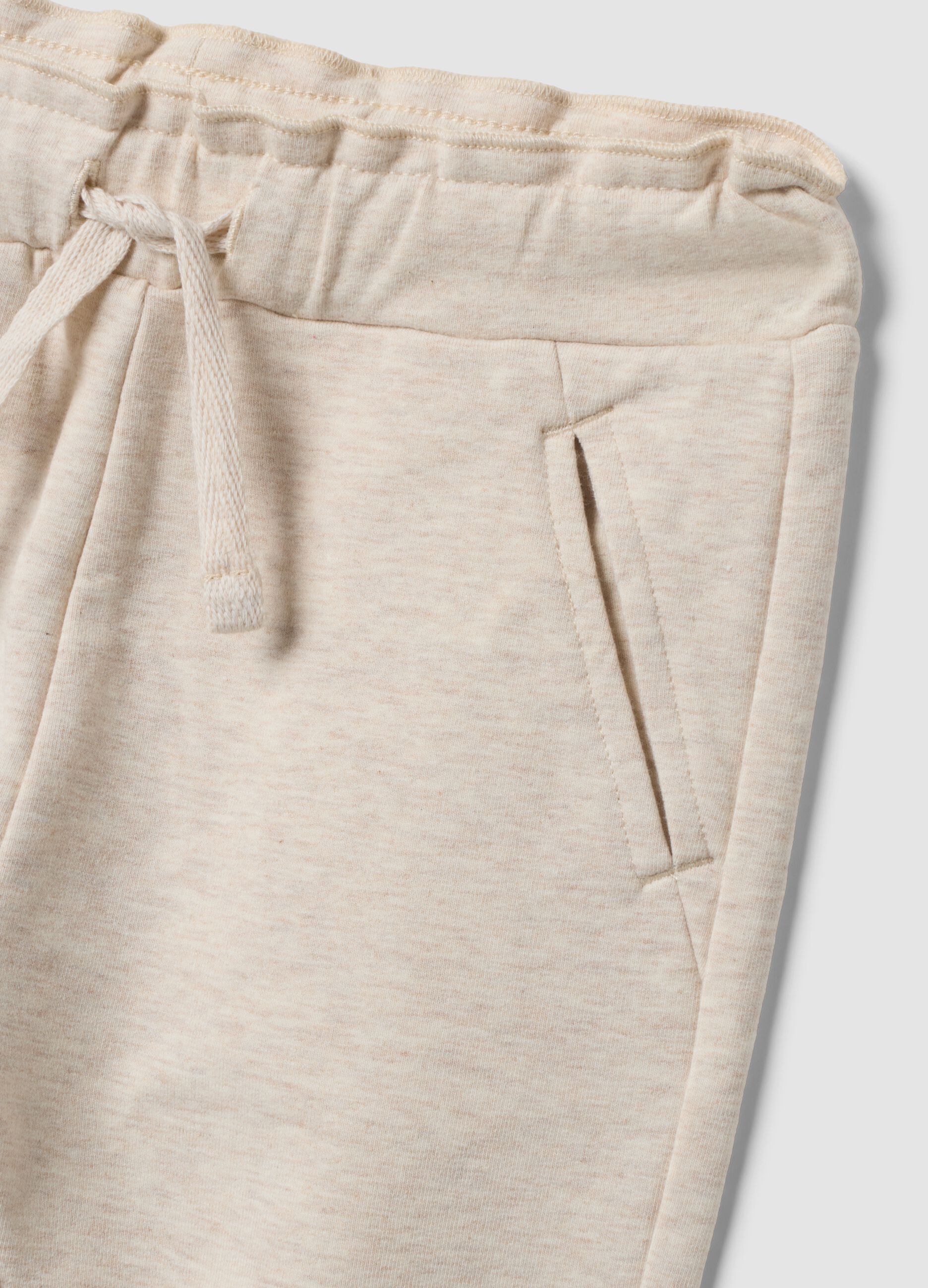 Beige stretch cotton joggers with turn-up cuff for baby girl