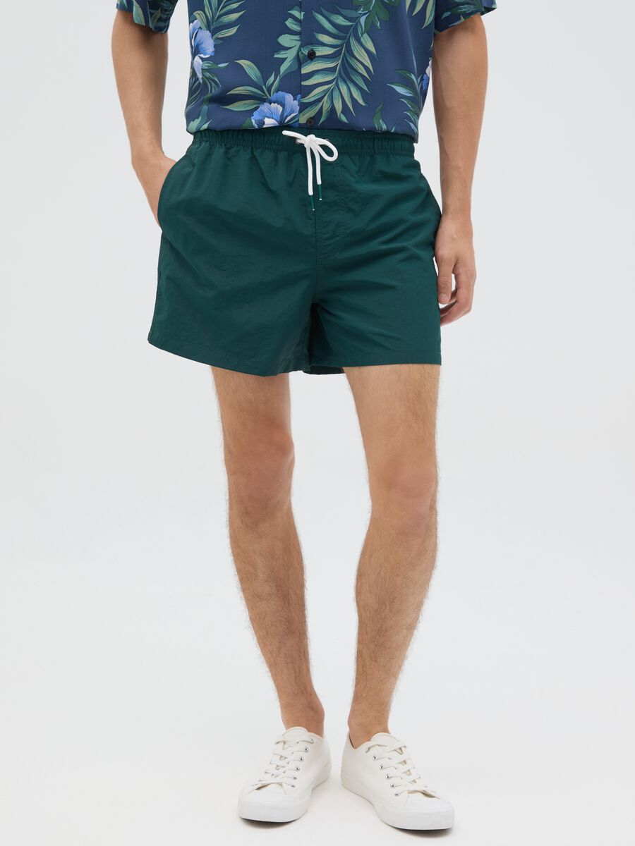 Green mixed fabric swim shorts_1