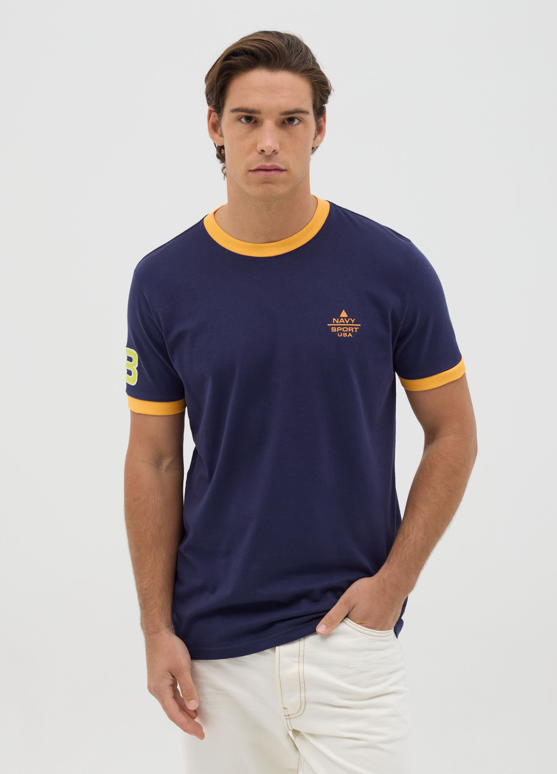 Blue T-shirt with short sleeves and orange details