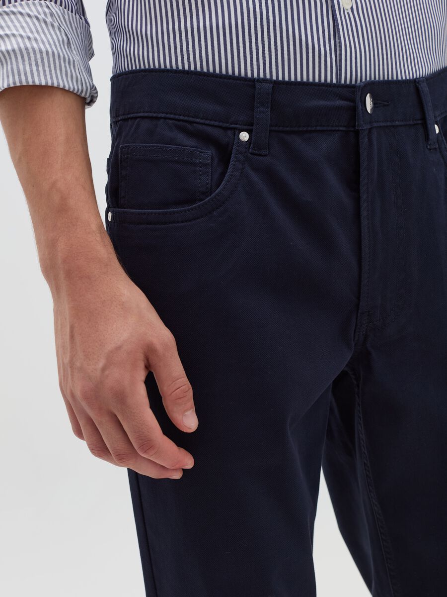 Trousers with five pockets and couture stitched weave_2