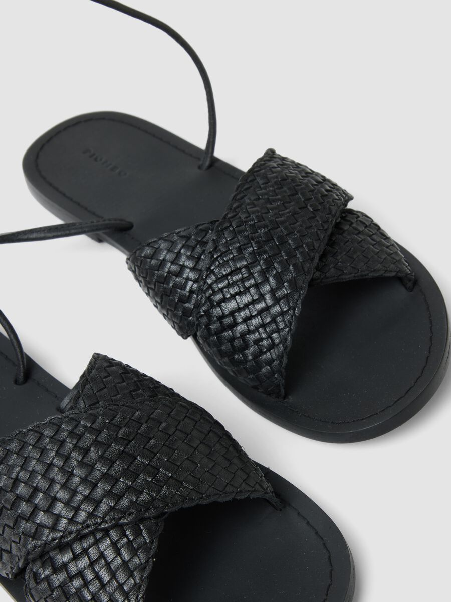 Black woven sandals with ankle ties_1