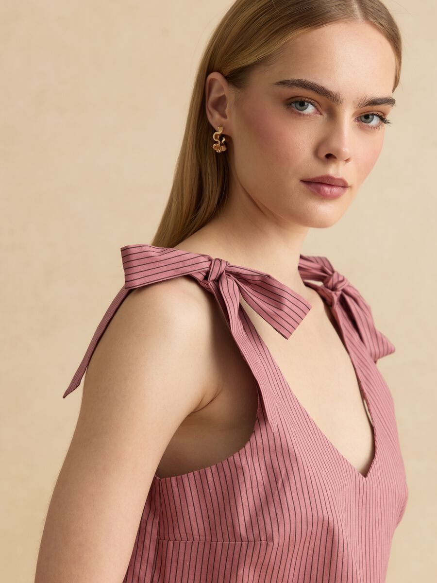 Blusa rosa in cotone elasticizzato con spalline annodate_0