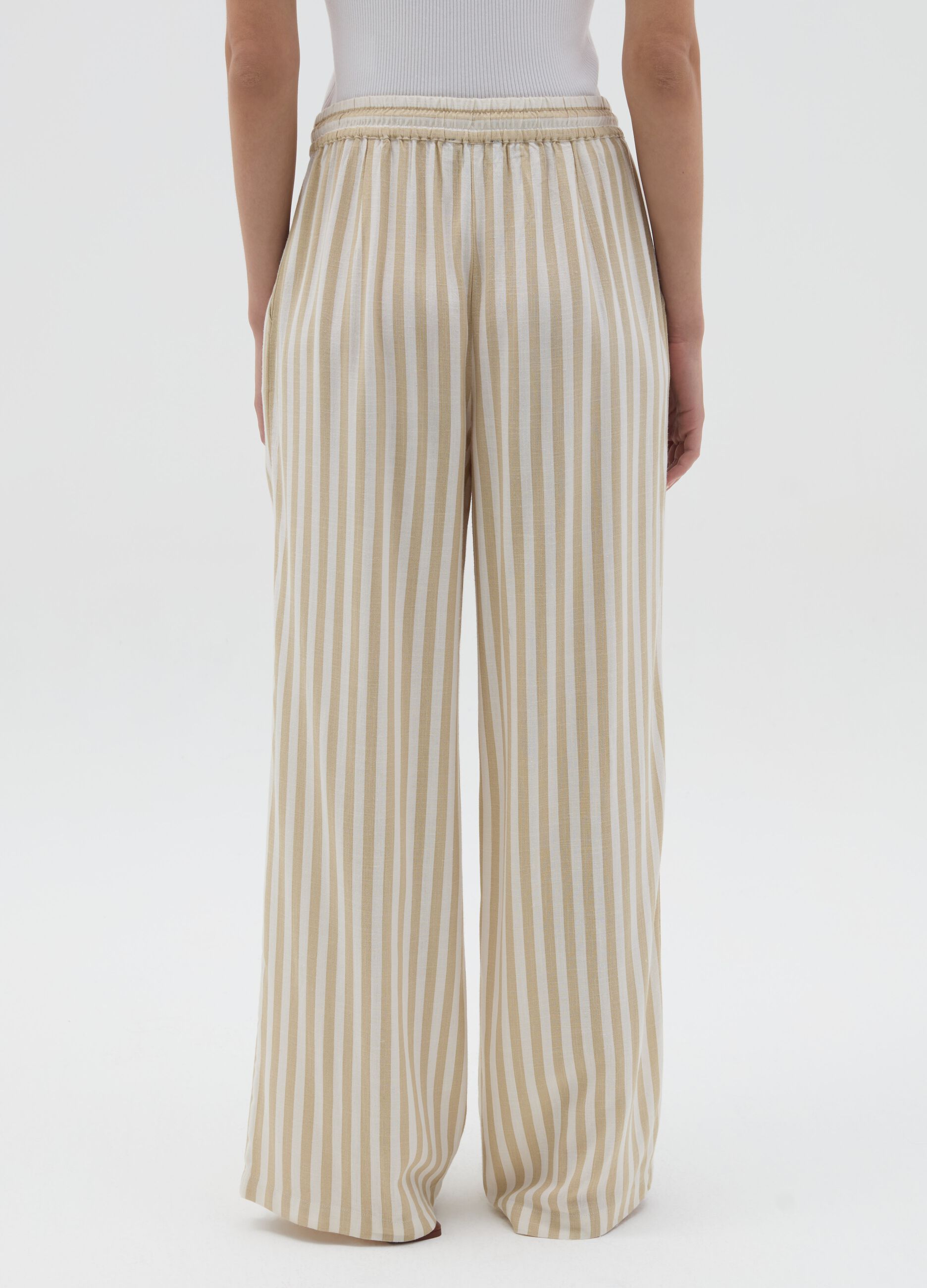 Striped beige palazzo trousers in viscose and linen