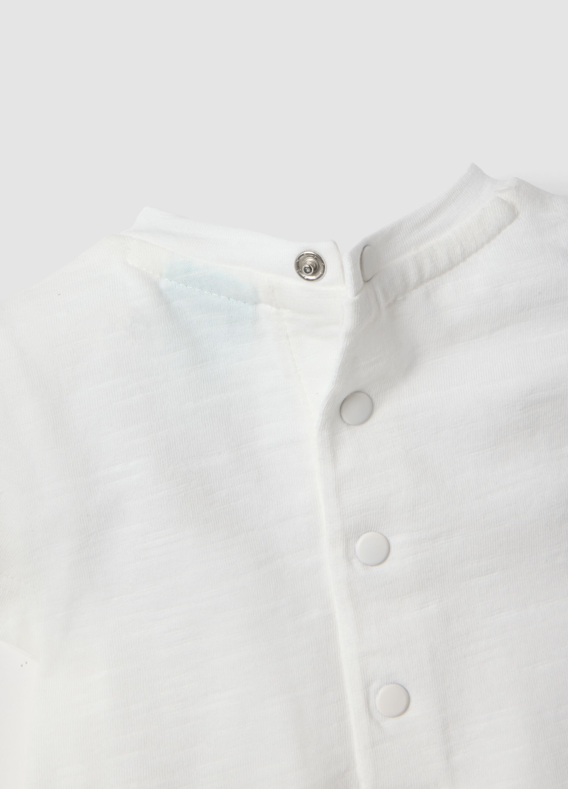 White and green organic cotton baby bodysuit