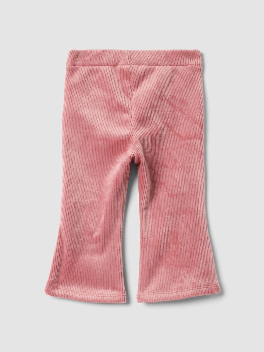 Pantaloni flare rosa in tessuto elasticizzato a costine_1