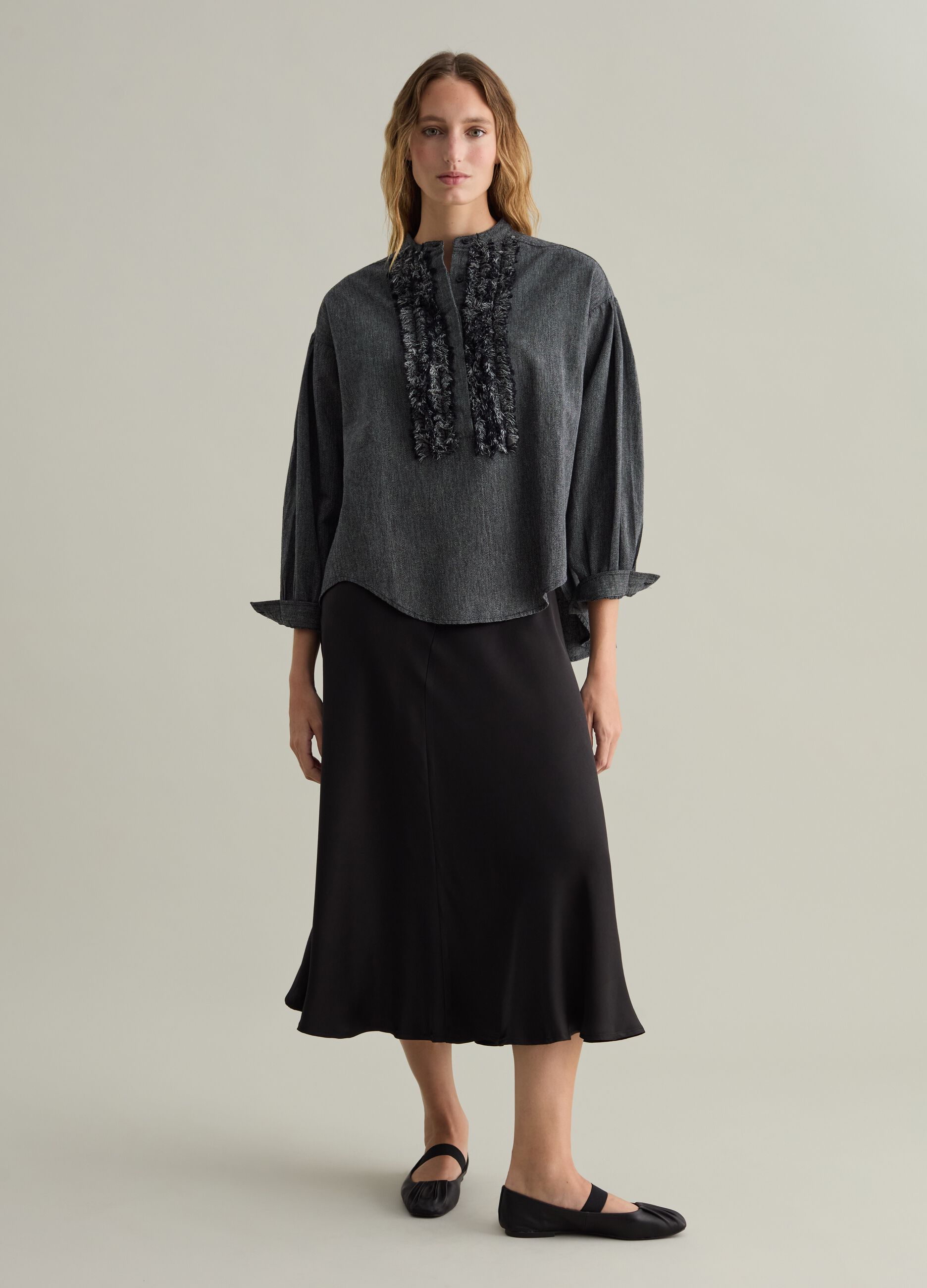 Contemporary blouse with fringed details