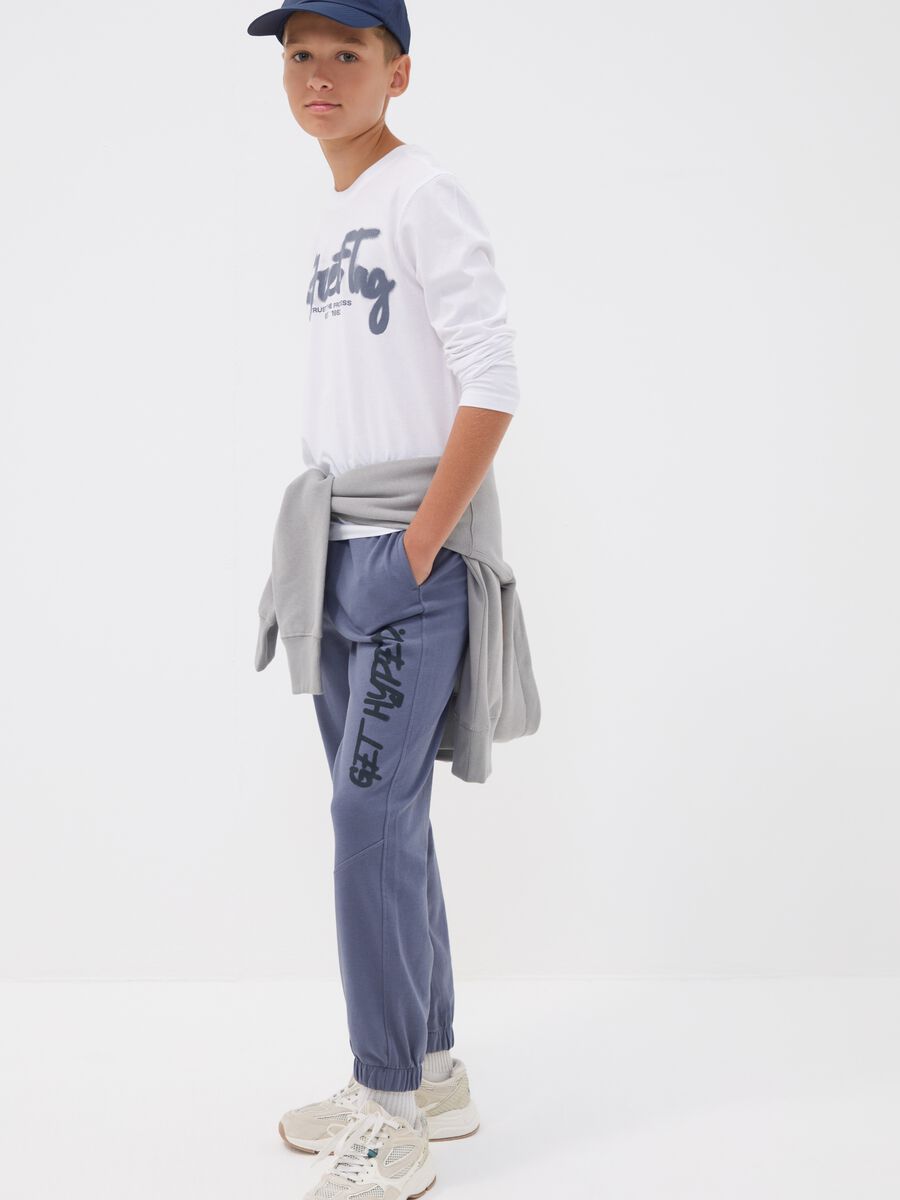 Pantaloni jogger over fit grigia in puro cotone con scritta "Get Hyped" per ragazzo_0