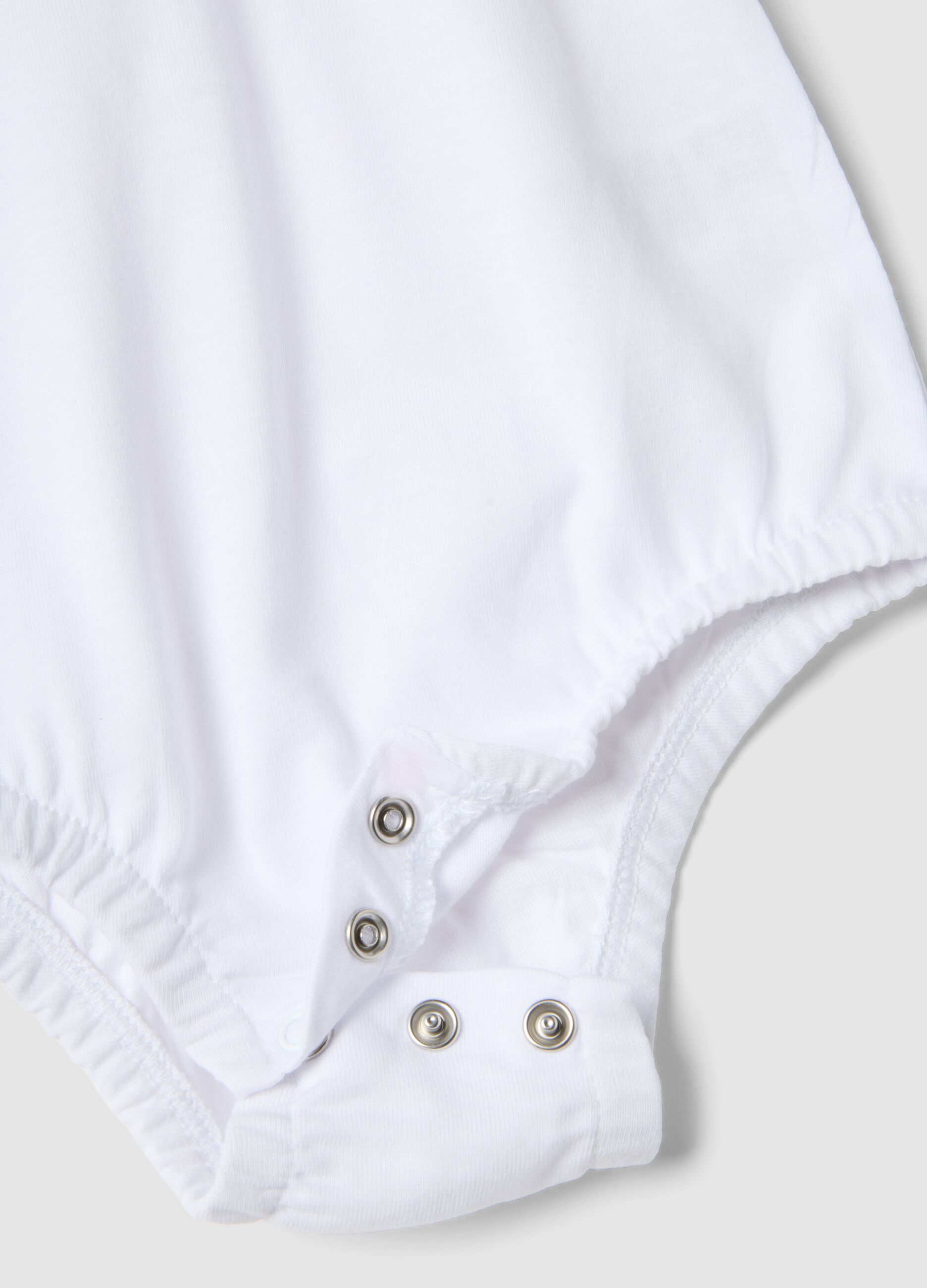 White organic cotton baby bodysuit with ruffled collar