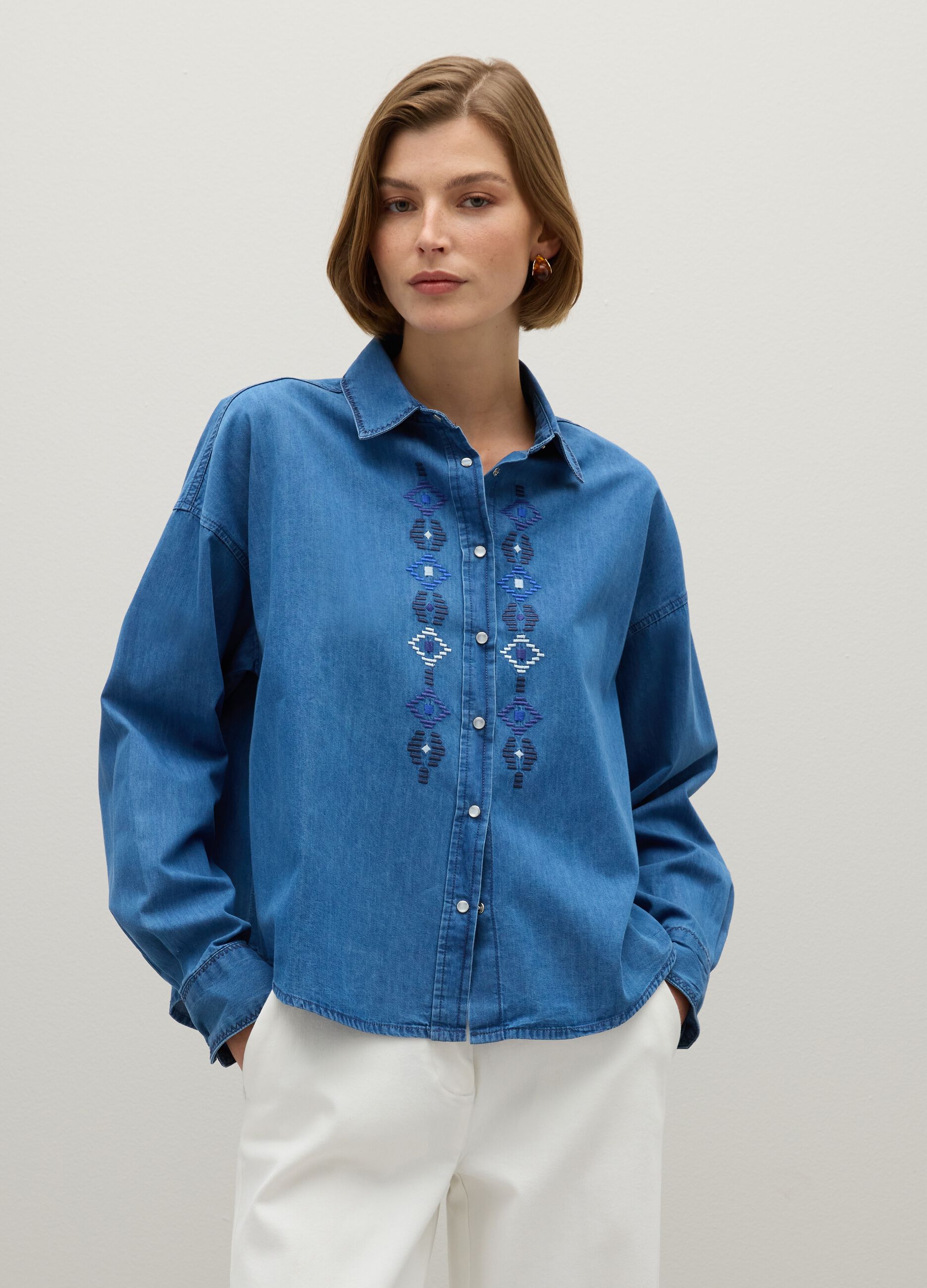 Blue cotton shirt with geometric embroidery